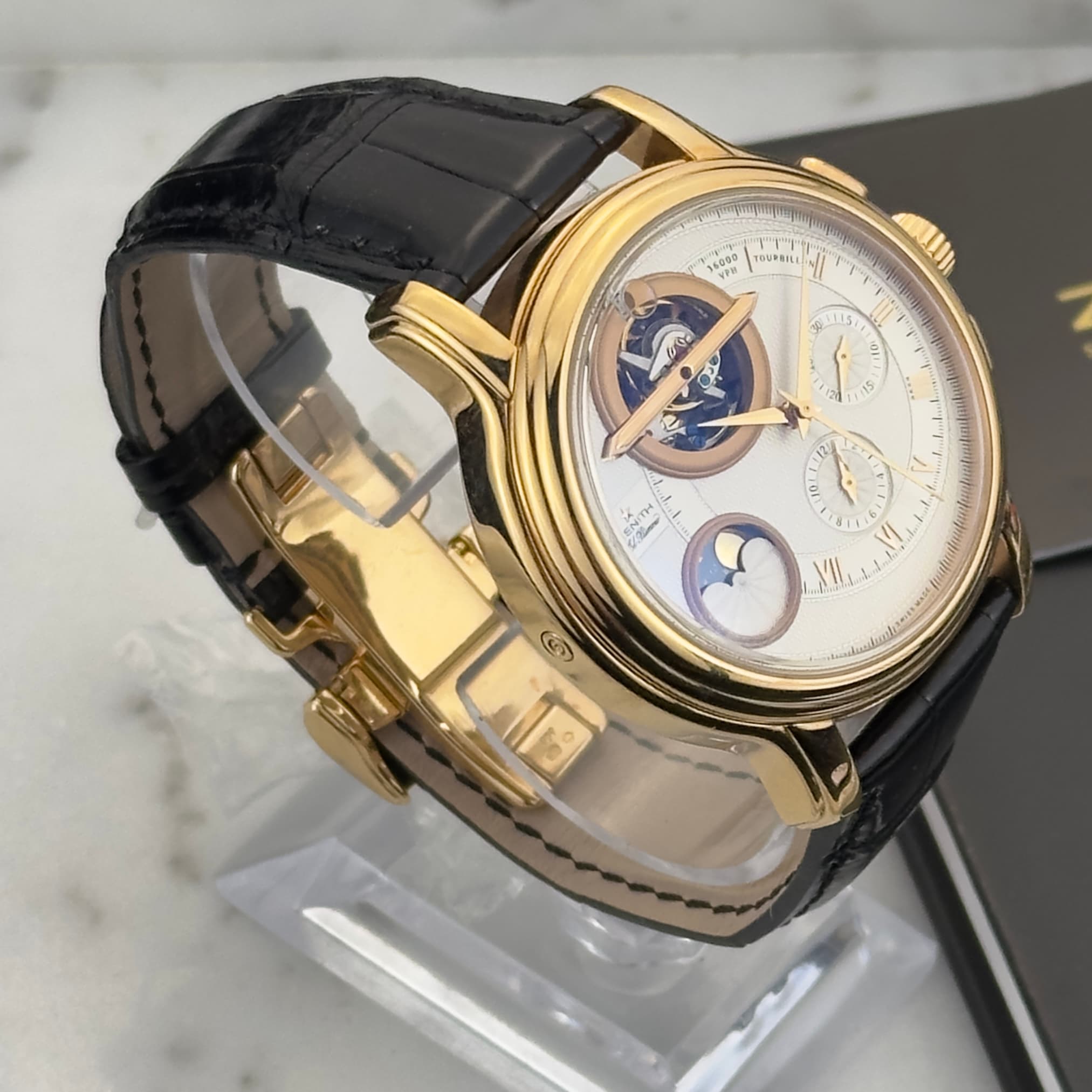 May be an image of wrist watch and text