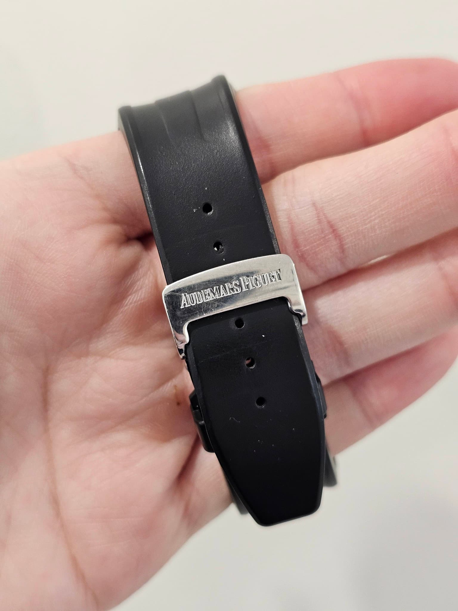 May be an image of leather, digital watch and text