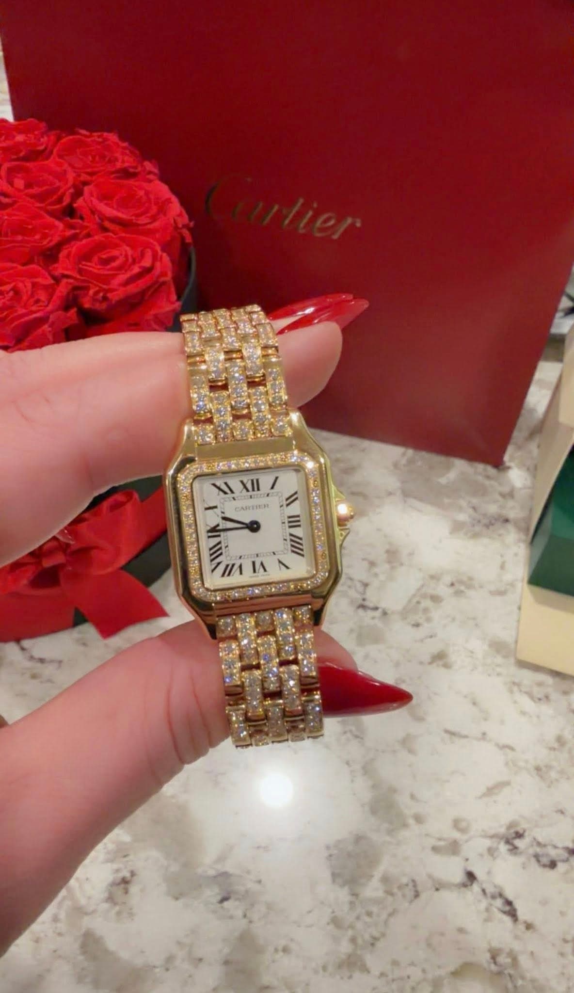 May be an image of wrist watch and text