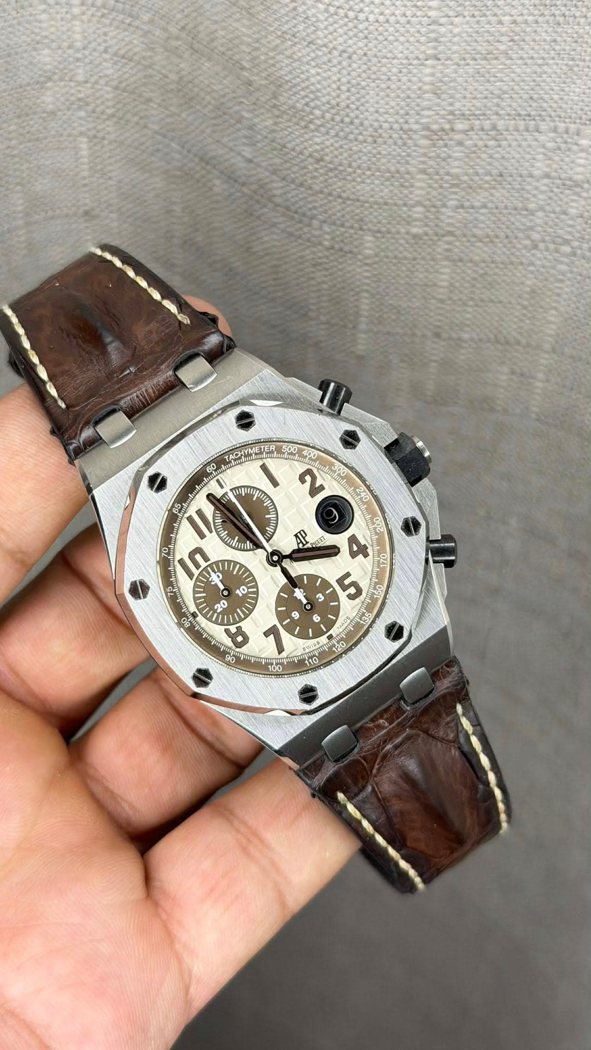 May be an image of wrist watch and text