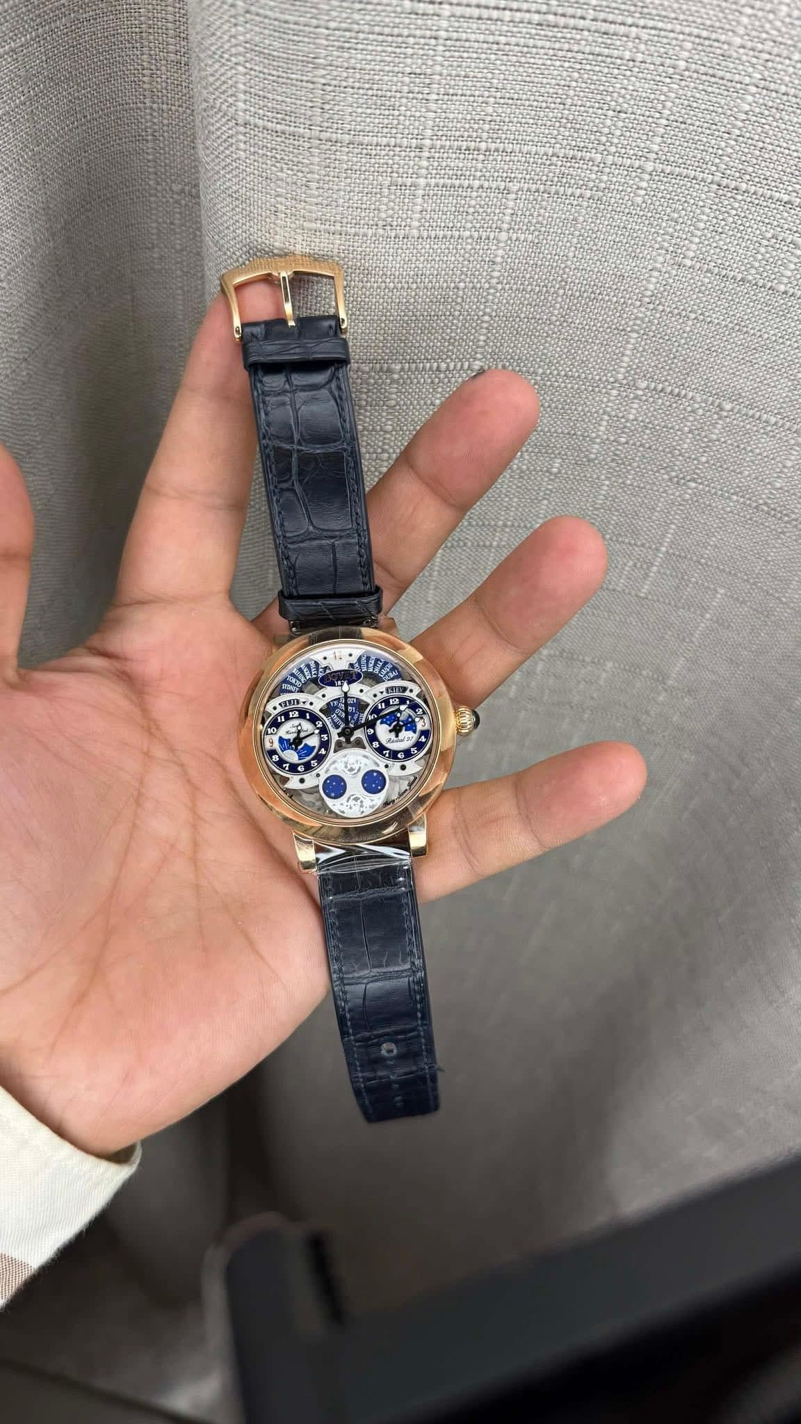 May be an image of wrist watch and text