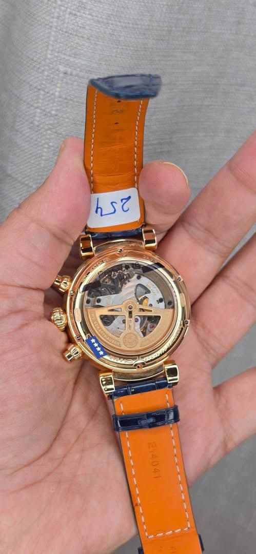 May be an image of wrist watch and text