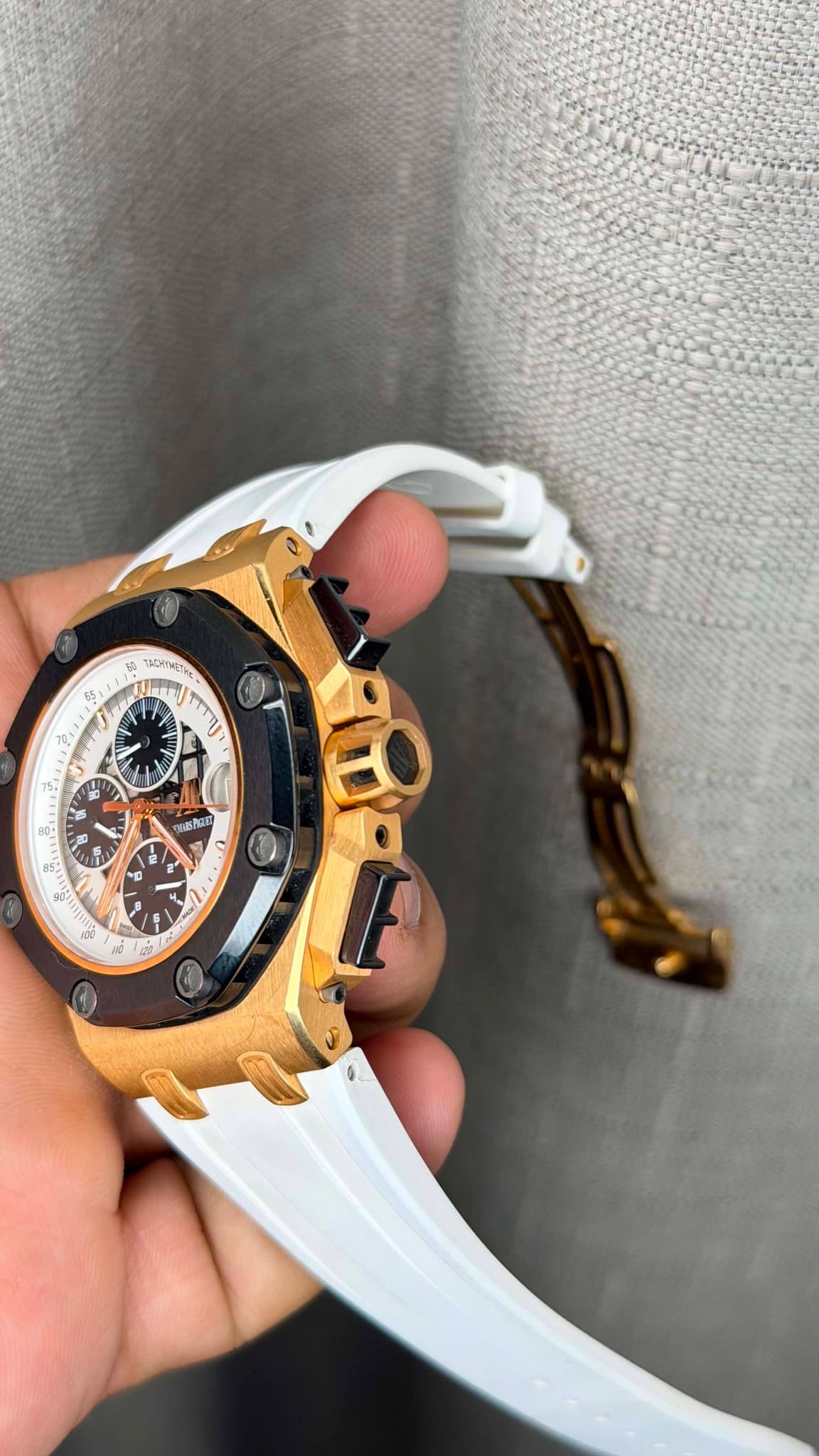 May be an image of wrist watch and text