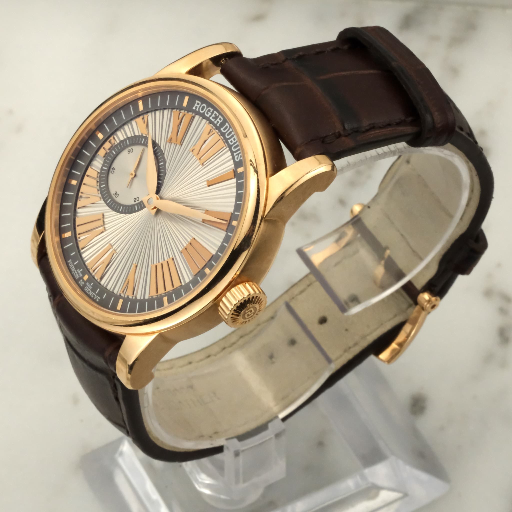 May be an image of wrist watch and text