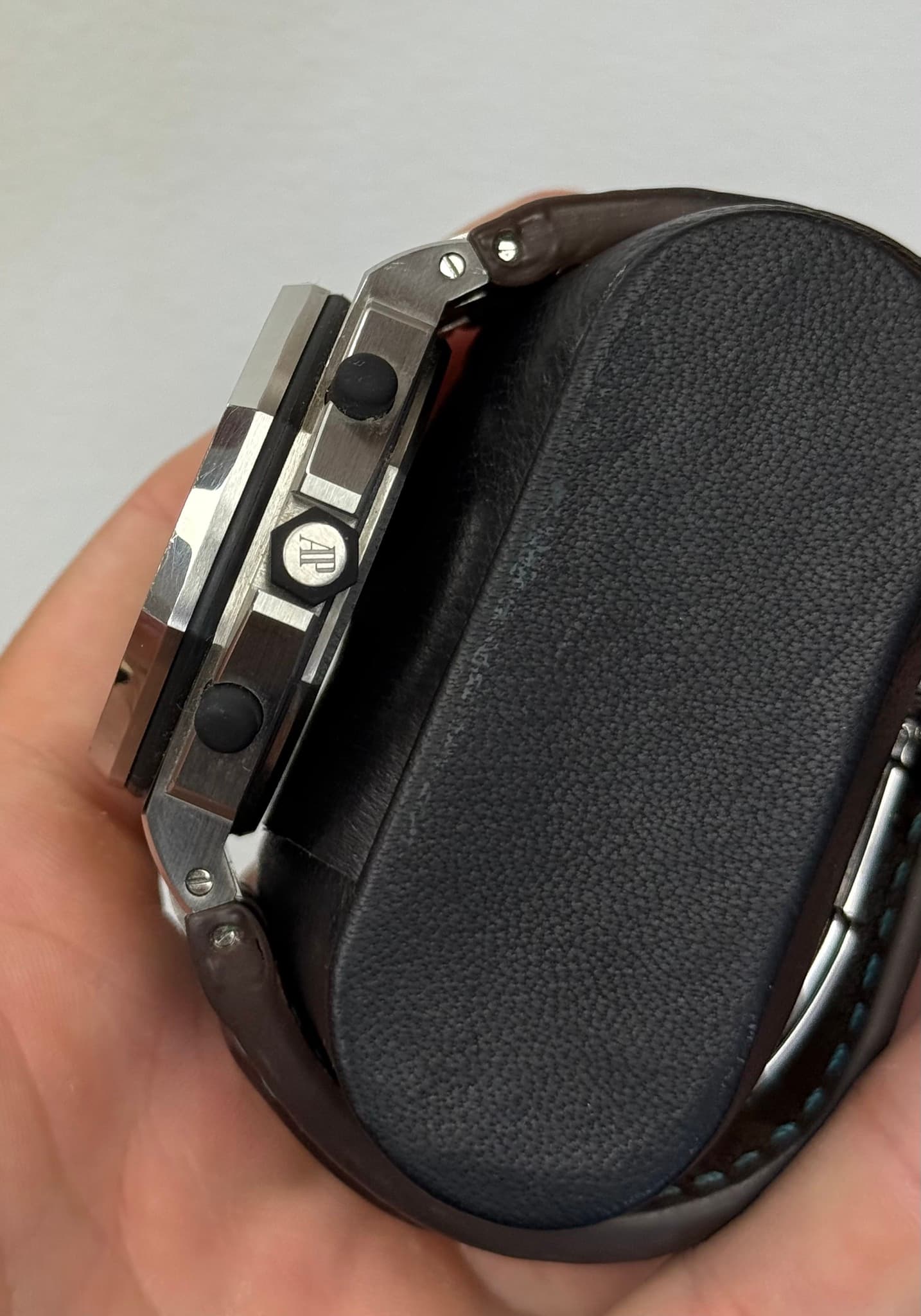 May be an image of saddle-stitched leather and wrist watch