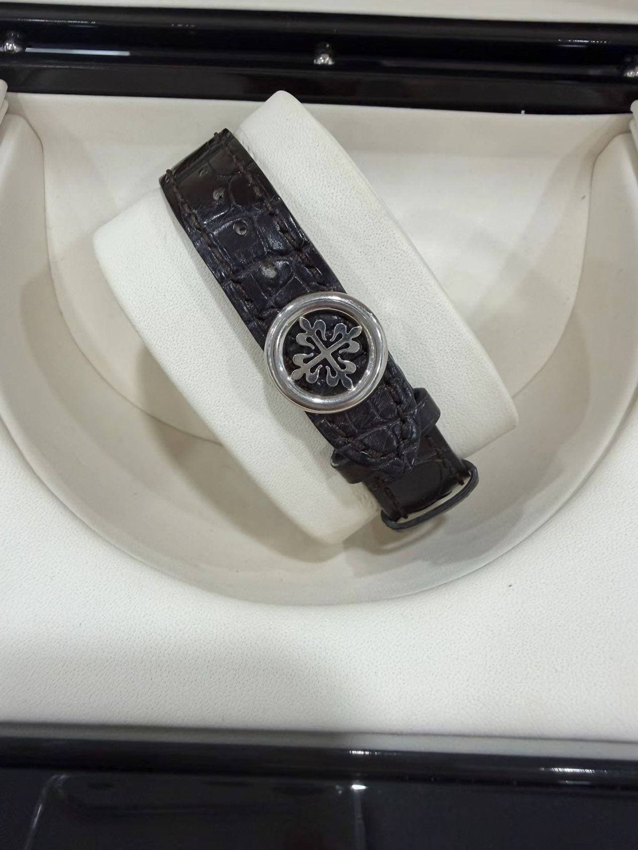 May be an image of wrist watch and text