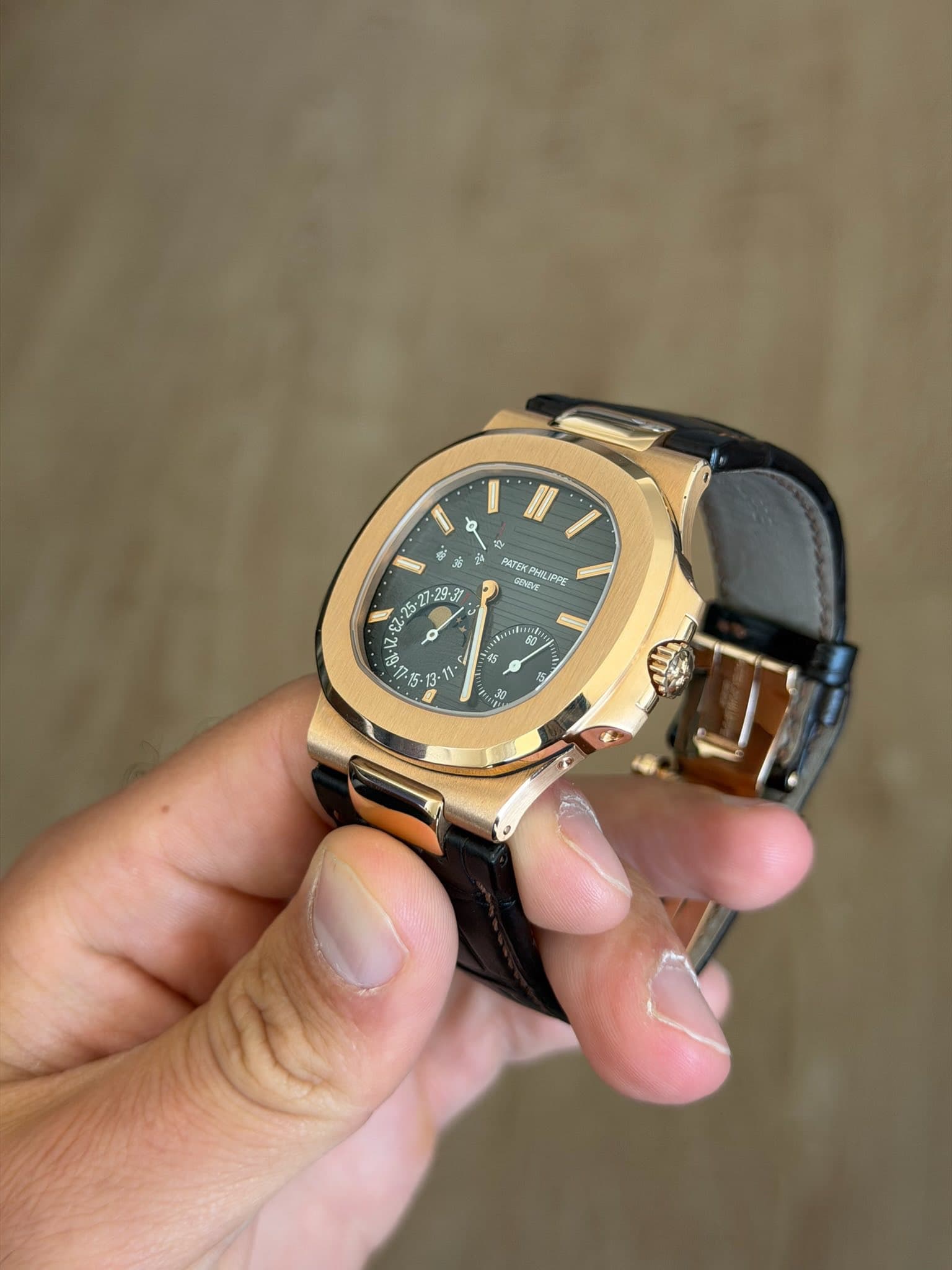 May be an image of wrist watch and text