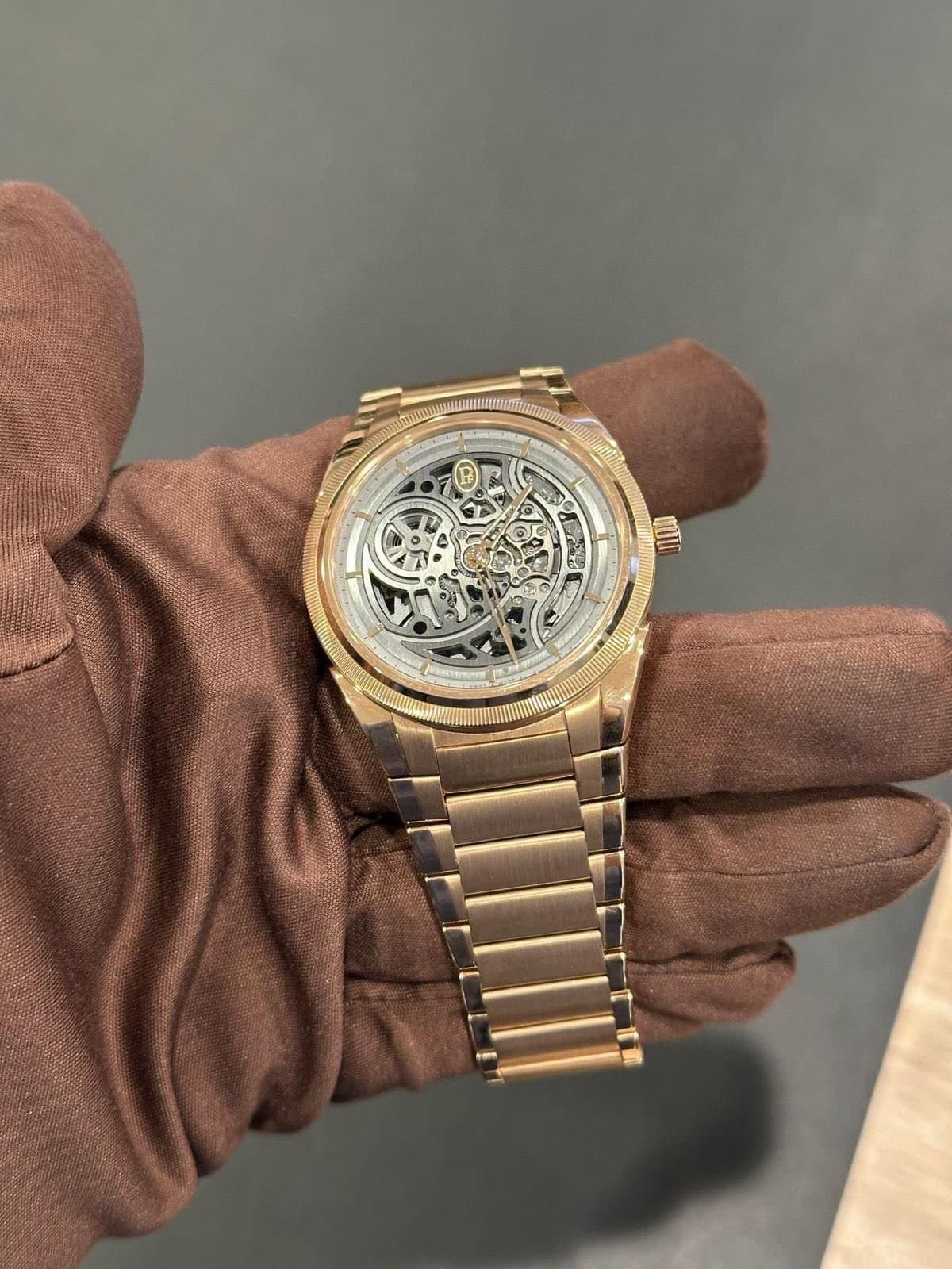 May be an image of wrist watch and text