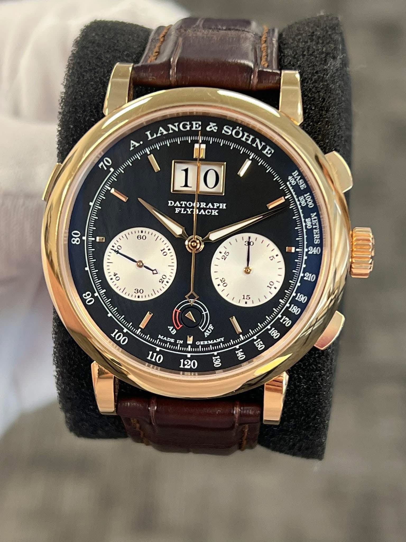 May be an image of wrist watch and text that says '70 LANGE み SÖHNE . 10 SSVE SS DATOGRAPH 1001 FLYJACK FLY I 1 II E1 O 15 സர் 00 B MADE MADE OI nlanlo អ GERMANY દ્રુ 120'
