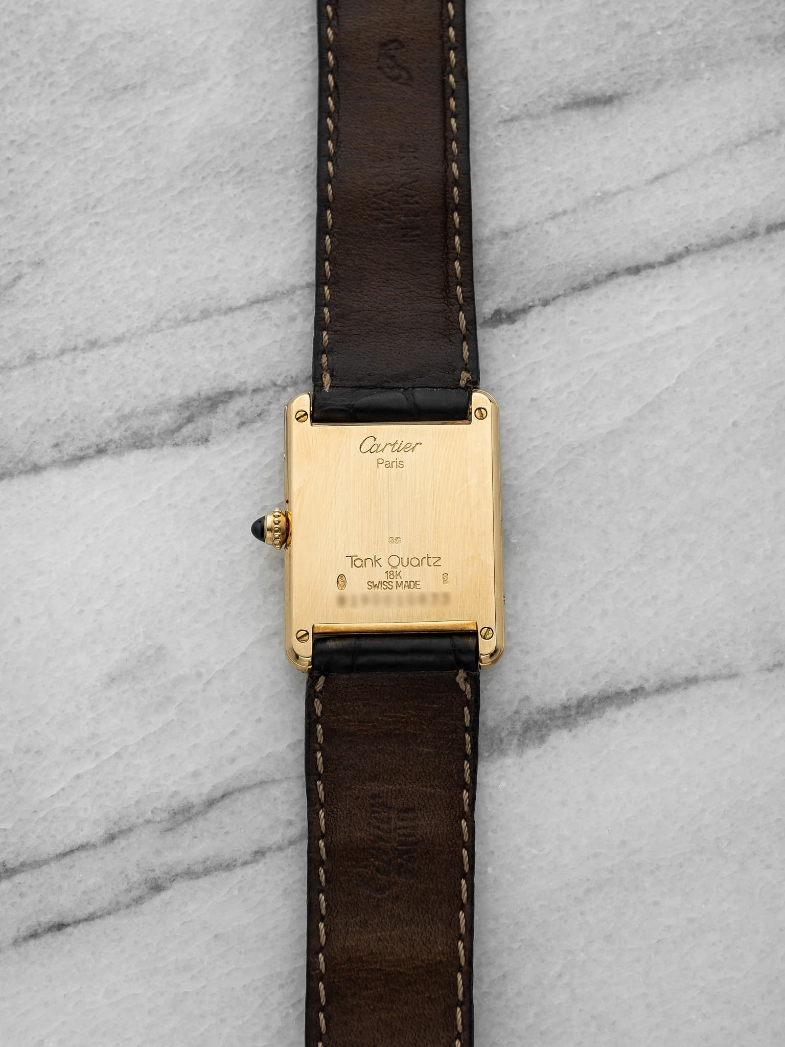 May be an image of leather, wrist watch and saddle-stitched leather