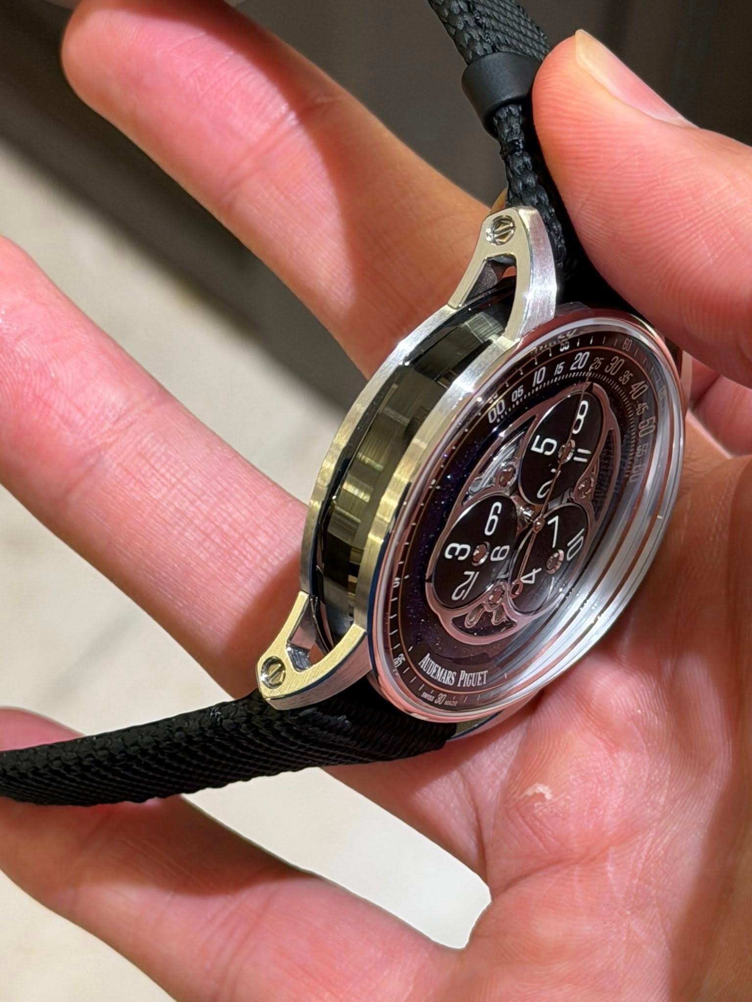 May be an image of wrist watch and text