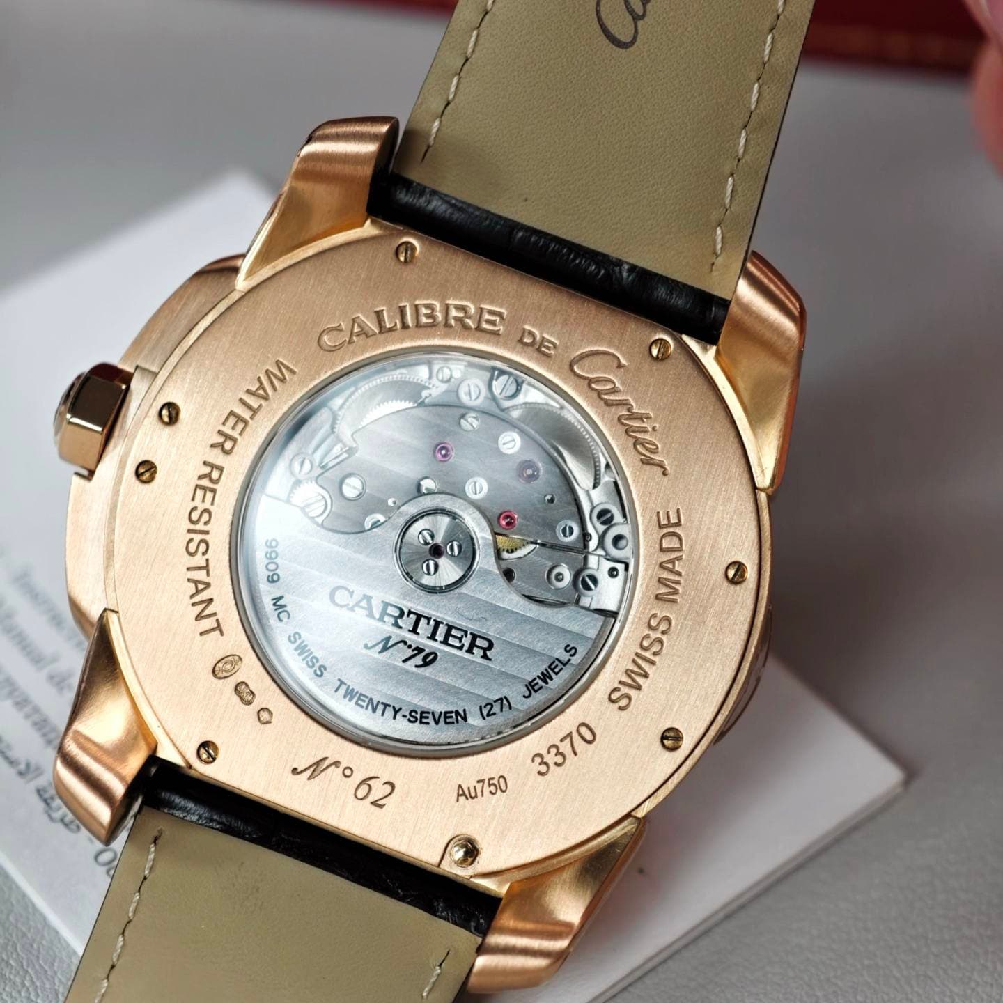 May be an image of wrist watch and text that says 'CALIBRE DE لمصم صار WATER 好58 9909 S MC 0 ( MADE C SWISS CARTIER N19 S O TWENTY TWENTY-SEVEN (27) JEWELS SWISS SWISS N°62 3370…