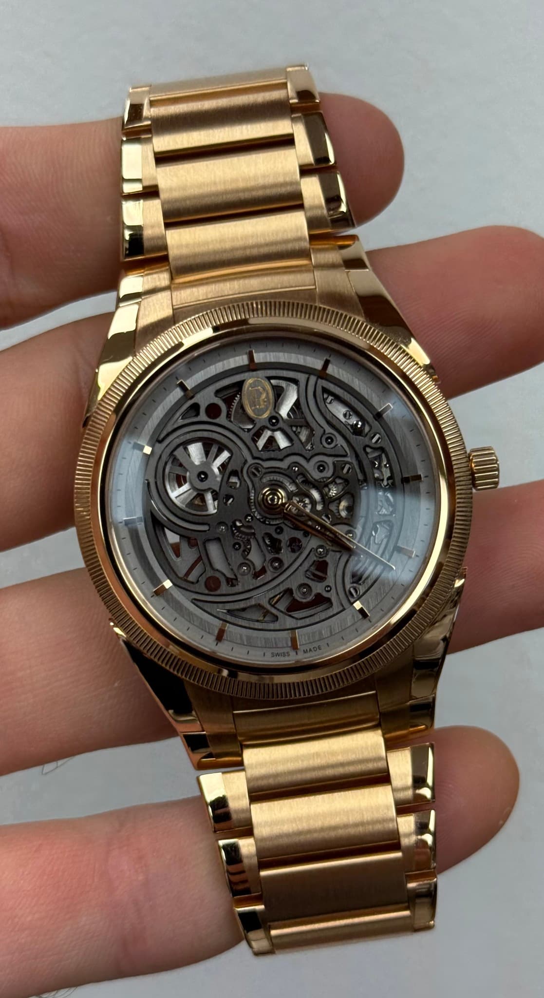 May be an image of wrist watch and text