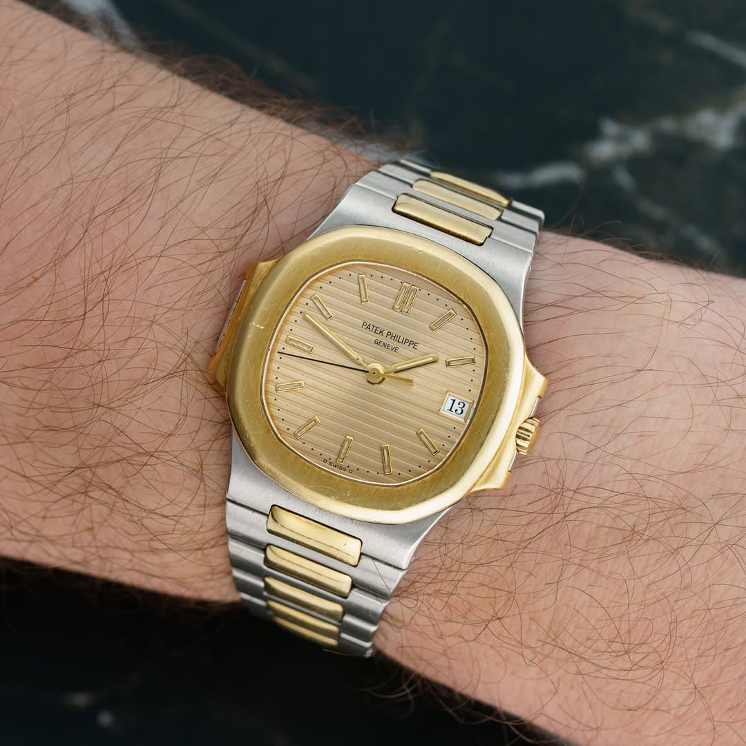 May be an image of wrist watch and text