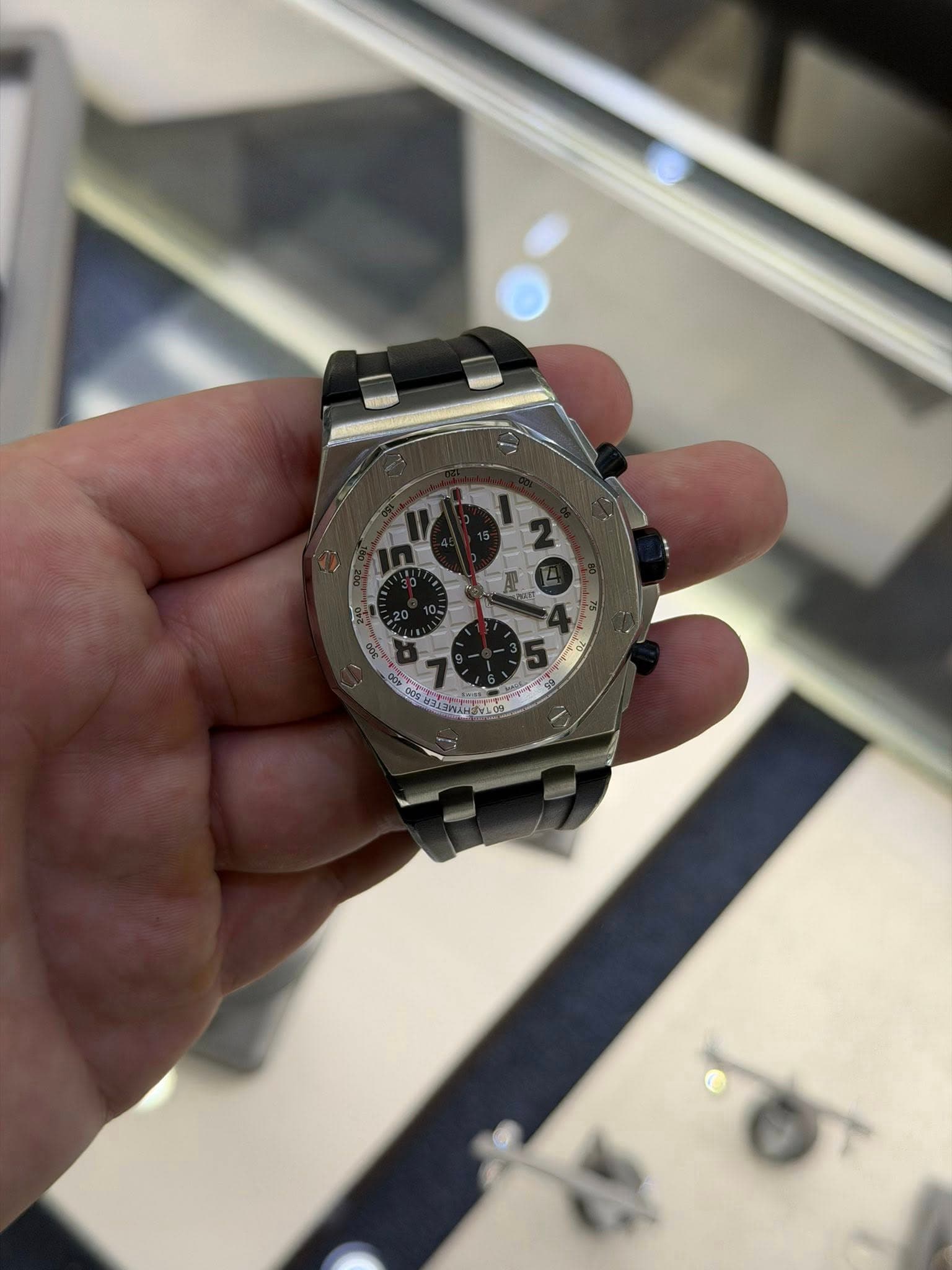 May be an image of wrist watch and text