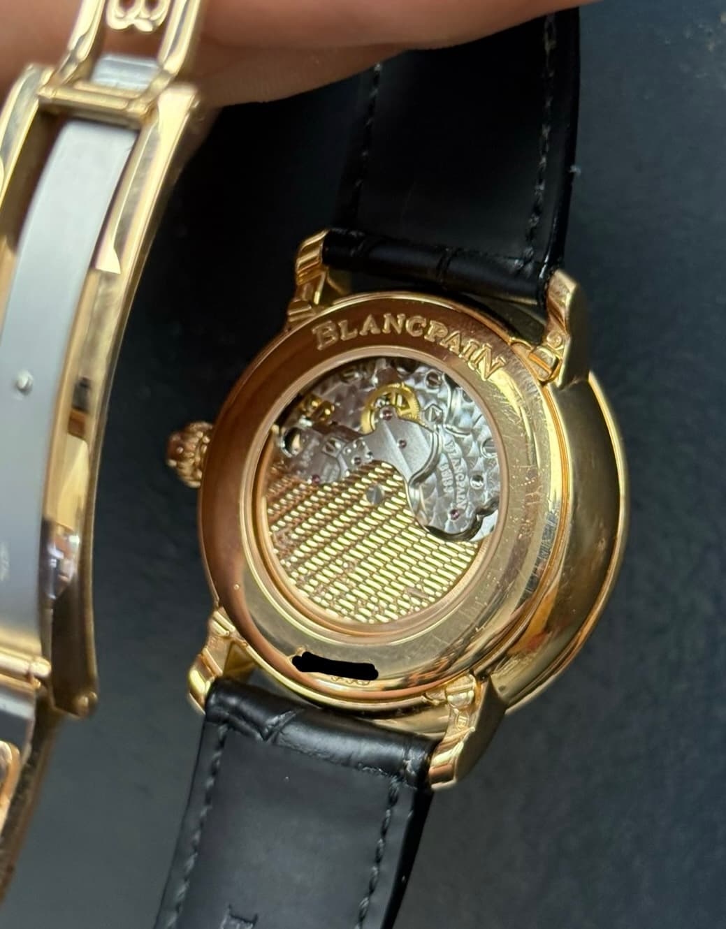 May be an image of wrist watch and text