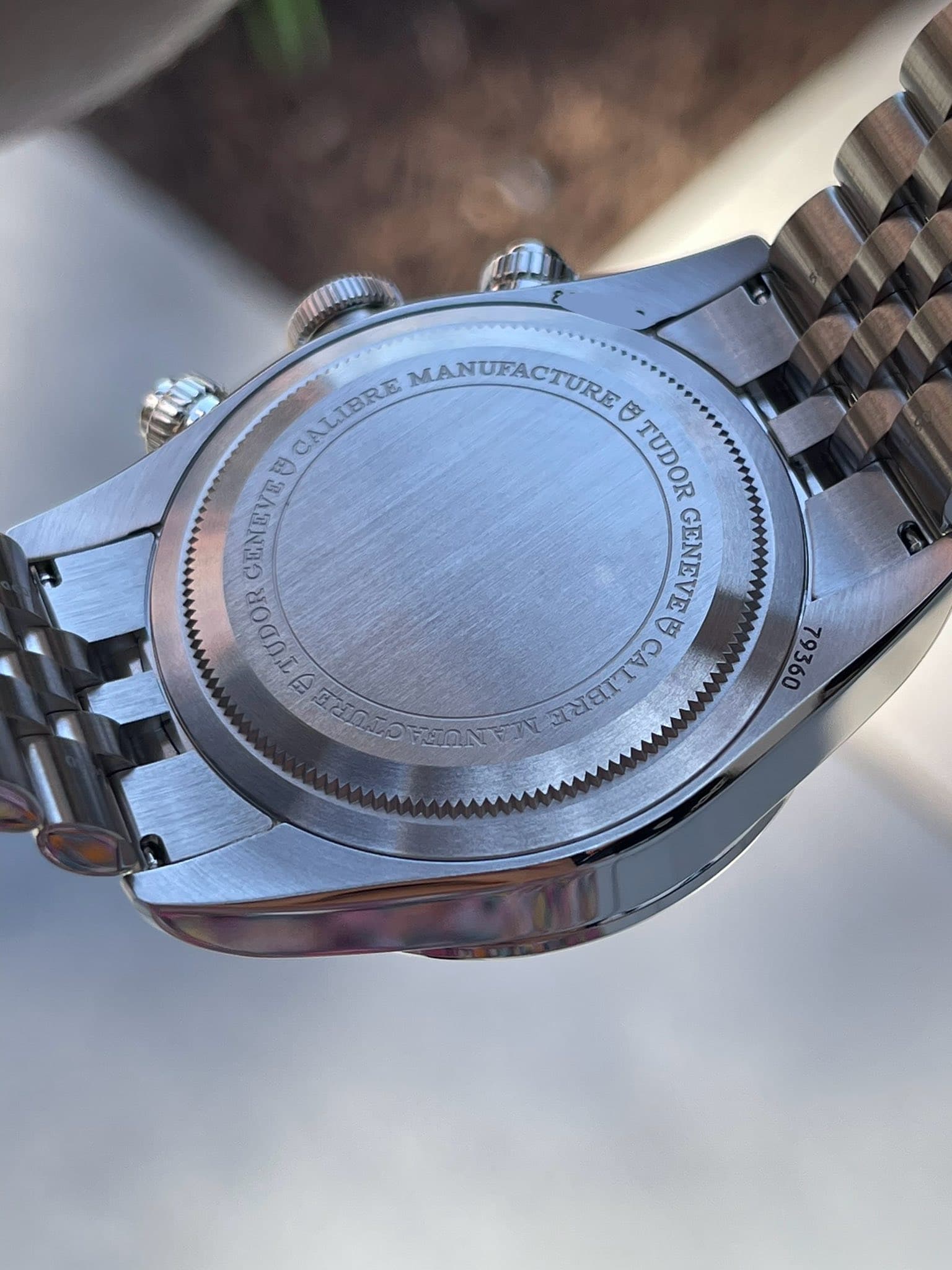 May be an image of wrist watch and text