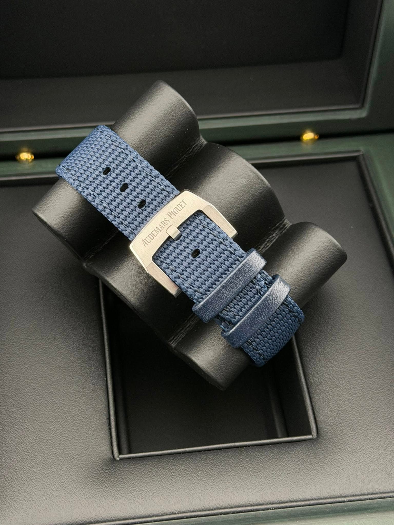 May be an image of wrist watch, saddle-stitched leather and text