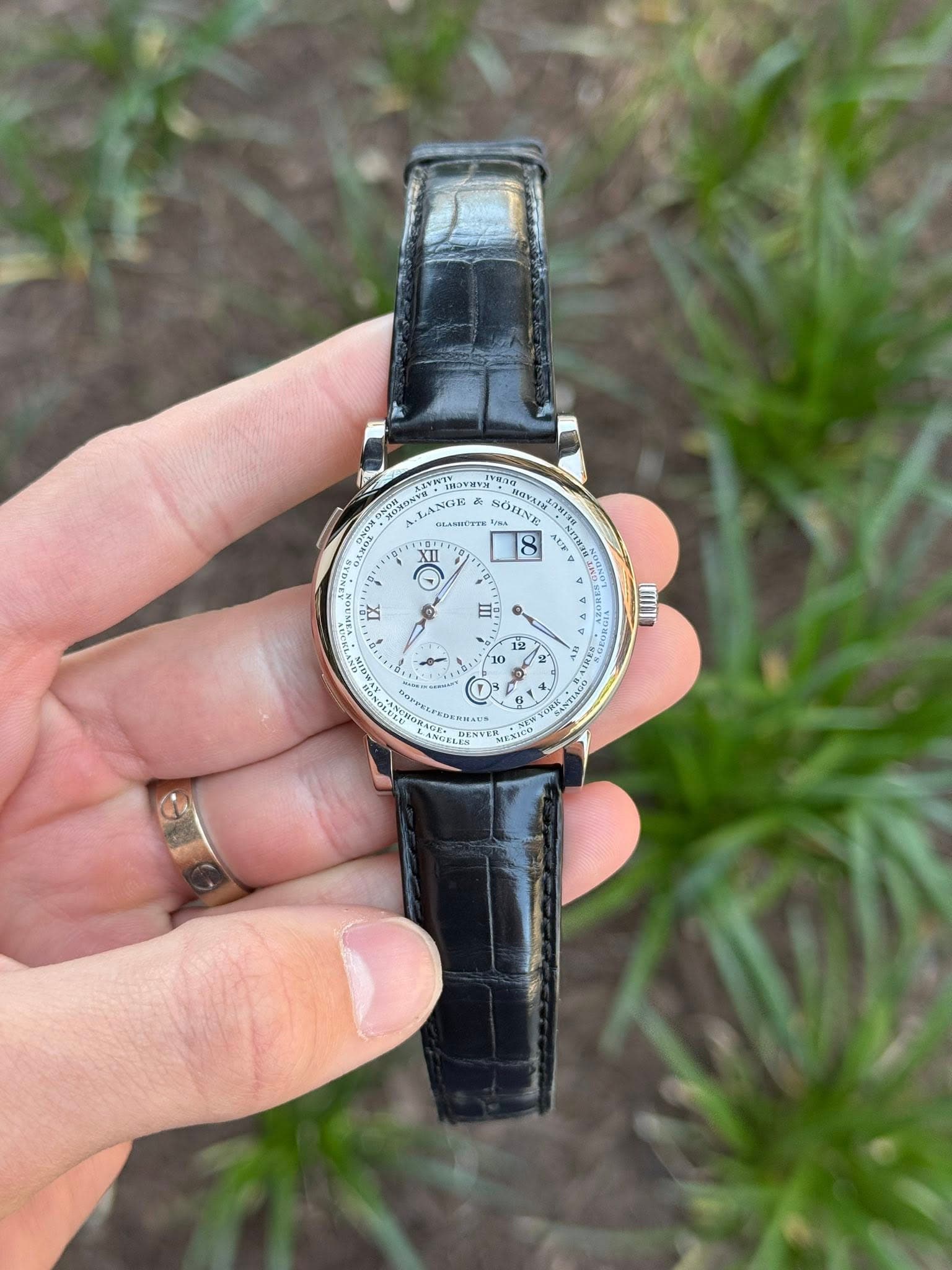 May be an image of wrist watch and text