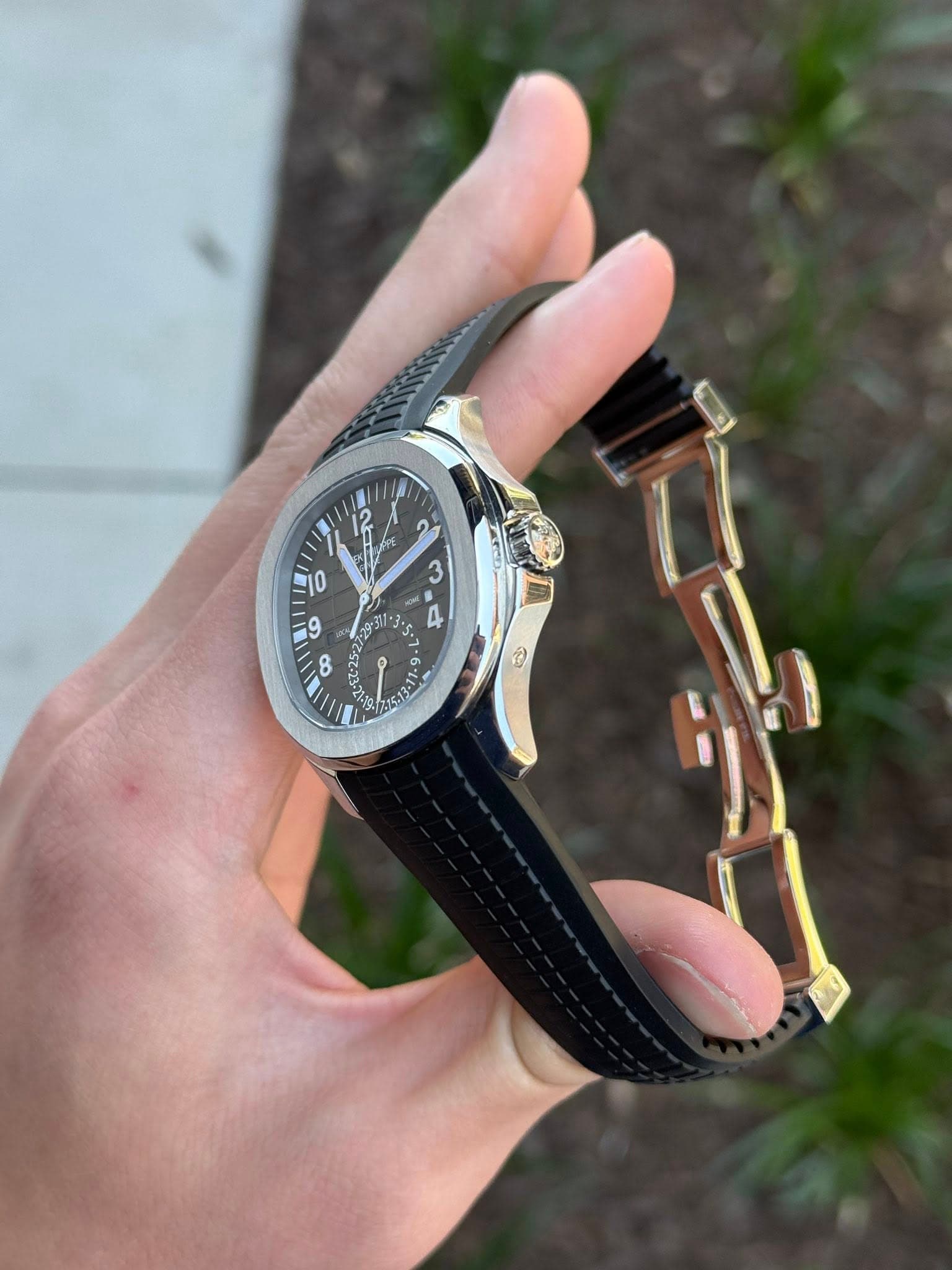 May be an image of wrist watch and text
