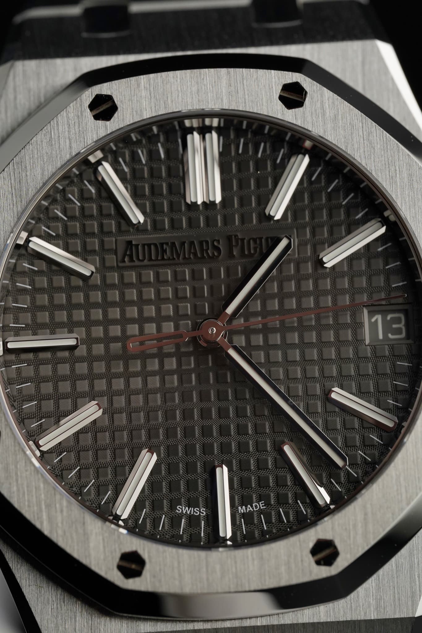 May be an image of wrist watch and text that says '|13 SWISS MADE'