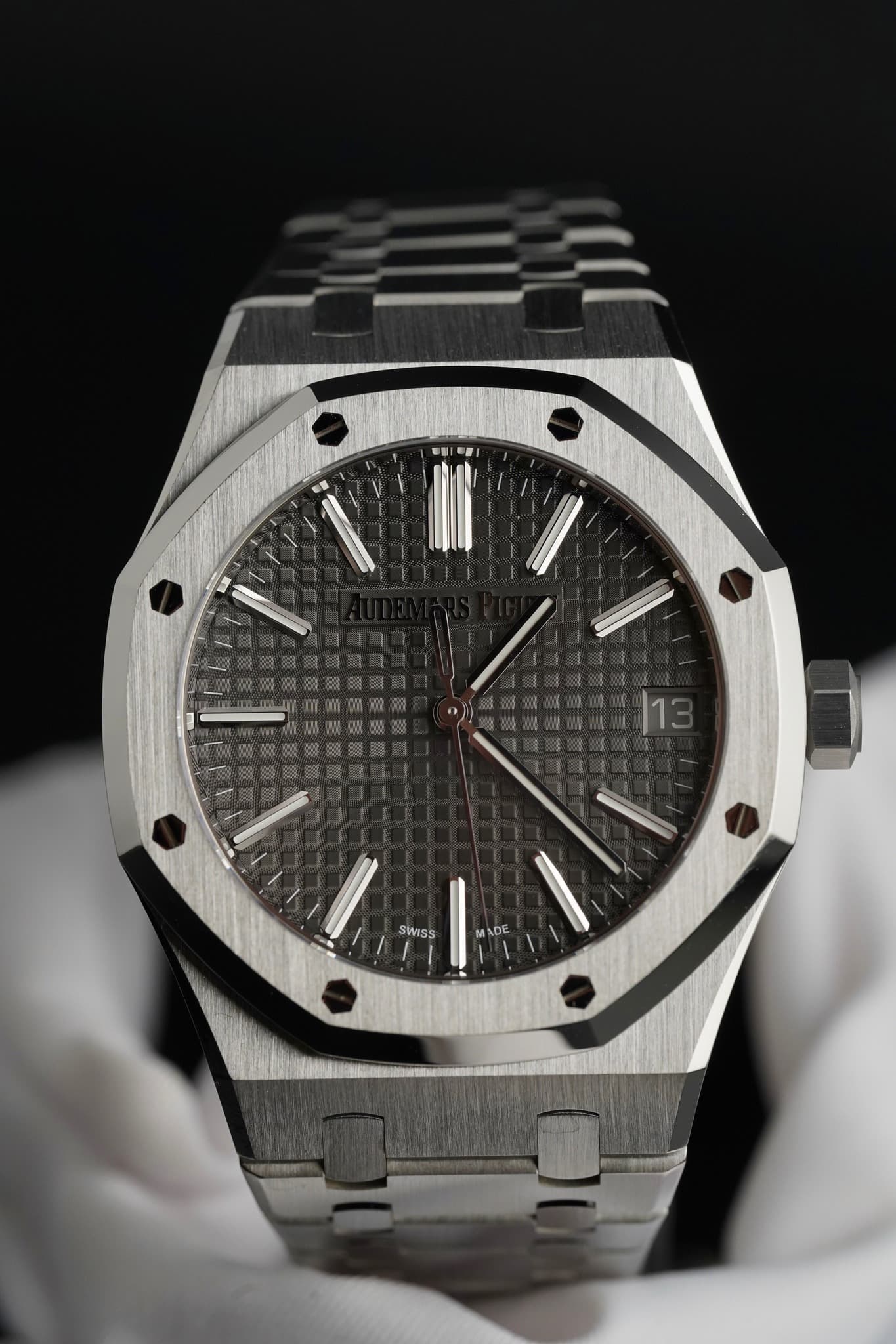 May be an image of wrist watch and text that says '|13 13 SWISS ADE DE'