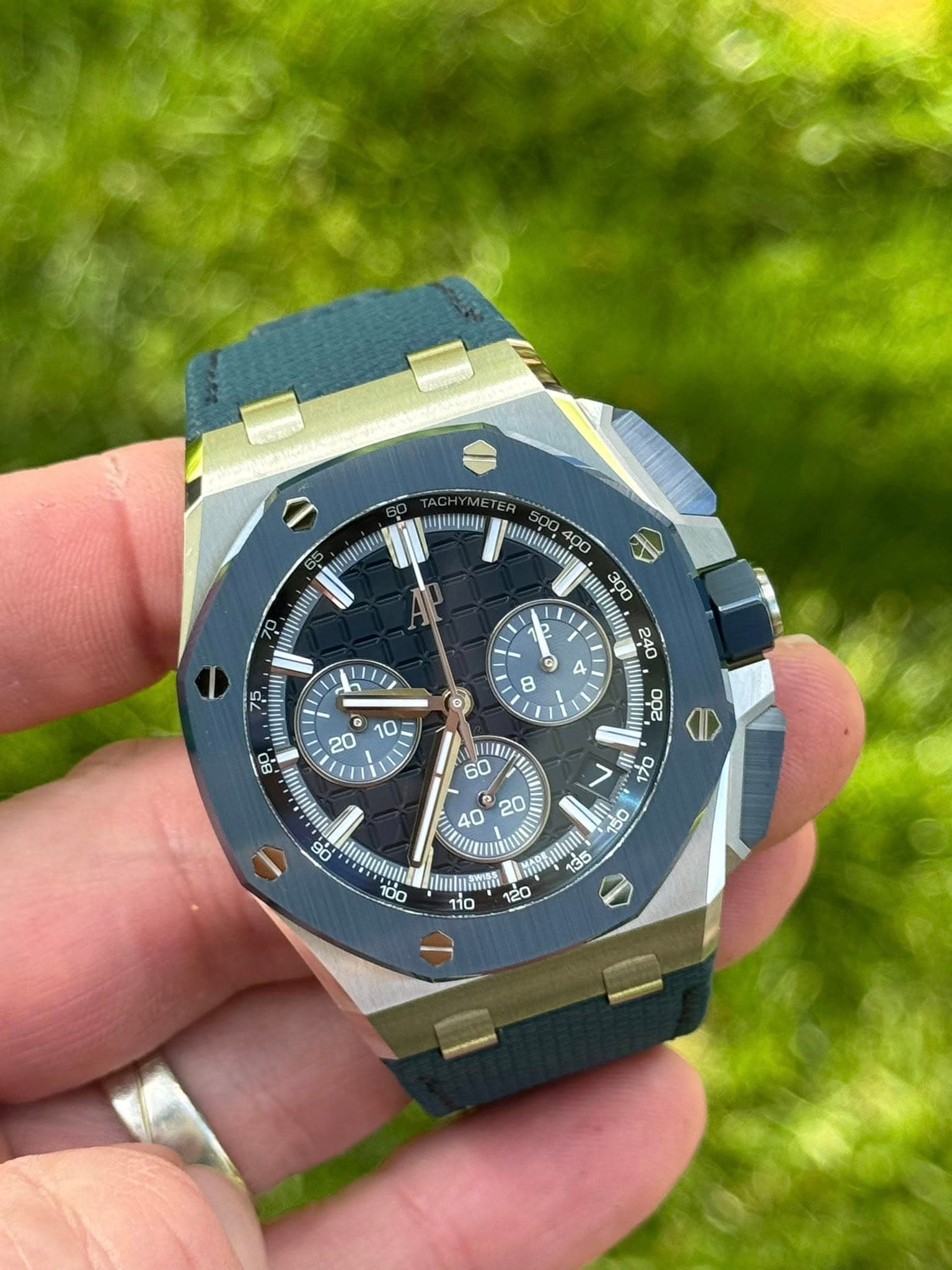 May be an image of wrist watch and text