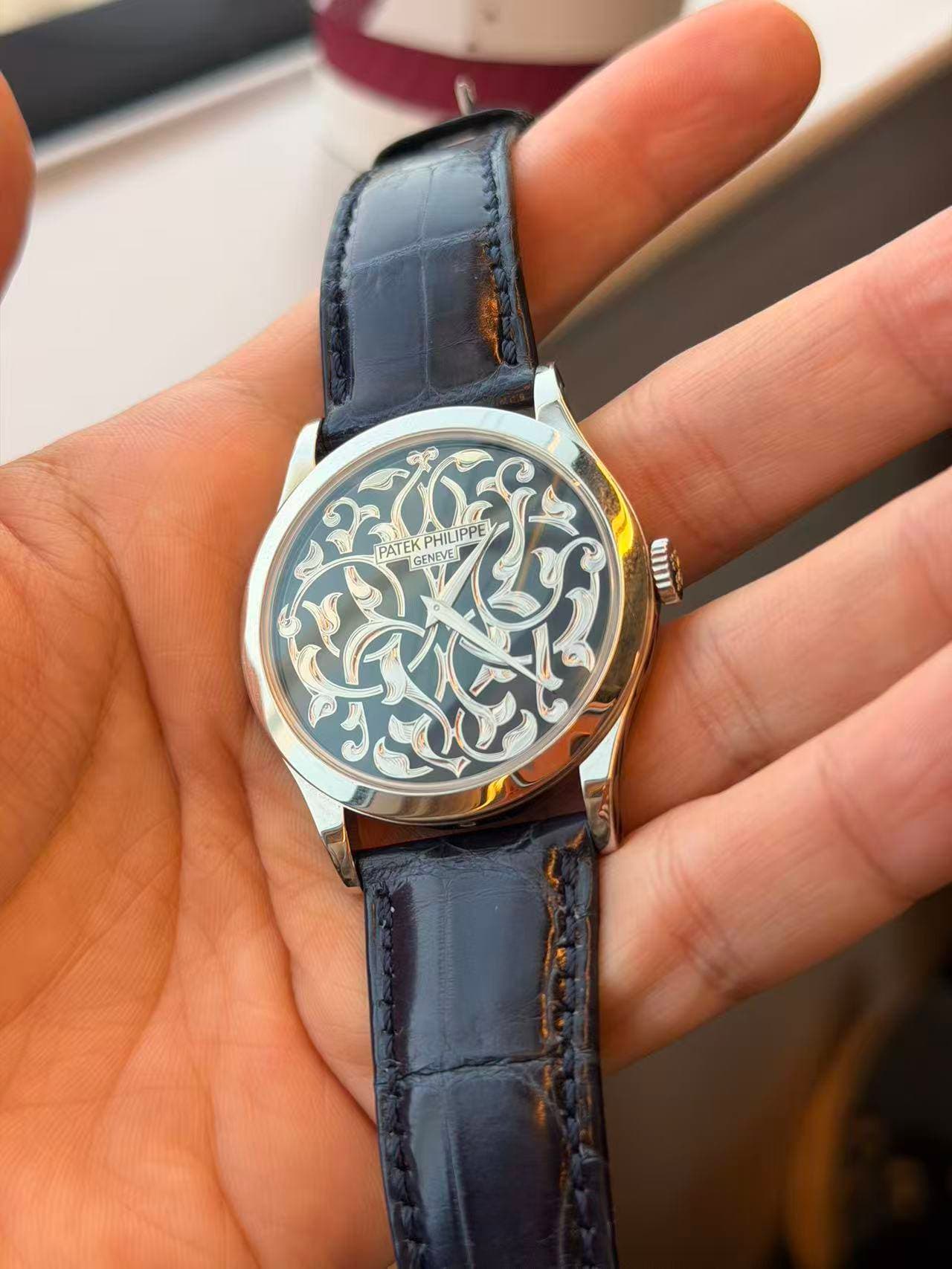 May be an image of wrist watch and text