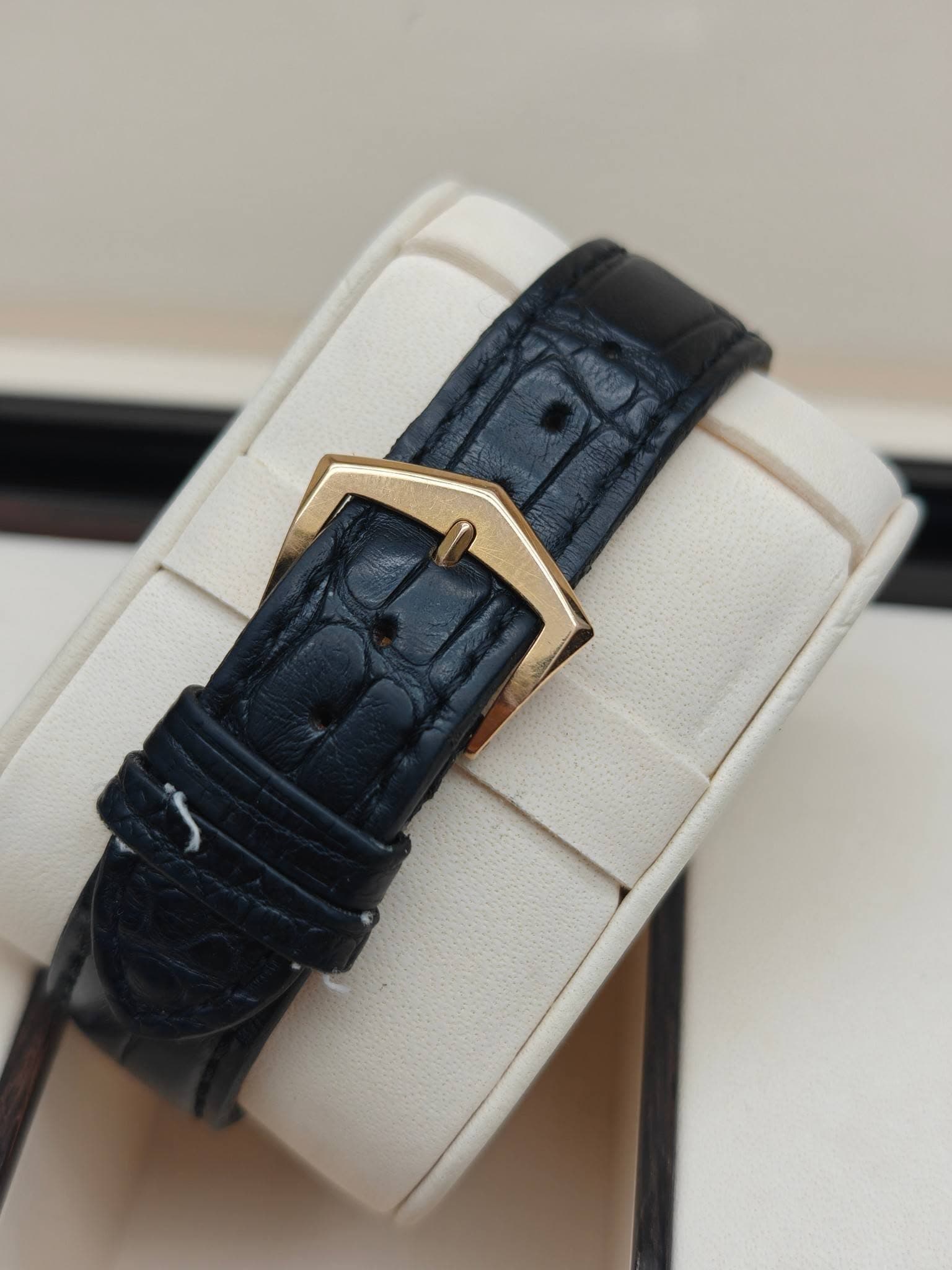 May be an image of wrist watch, leather and saddle-stitched leather