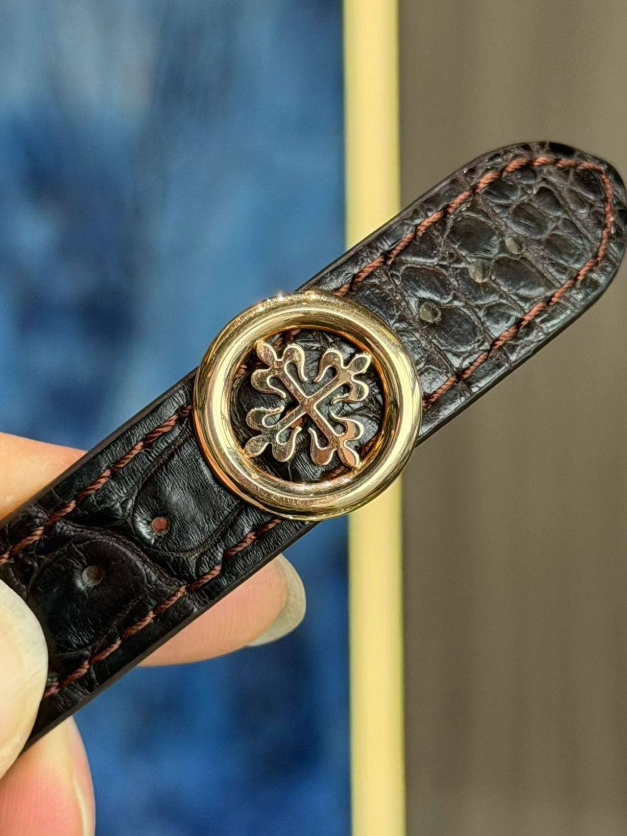 May be an image of wrist watch, saddle-stitched leather and leather