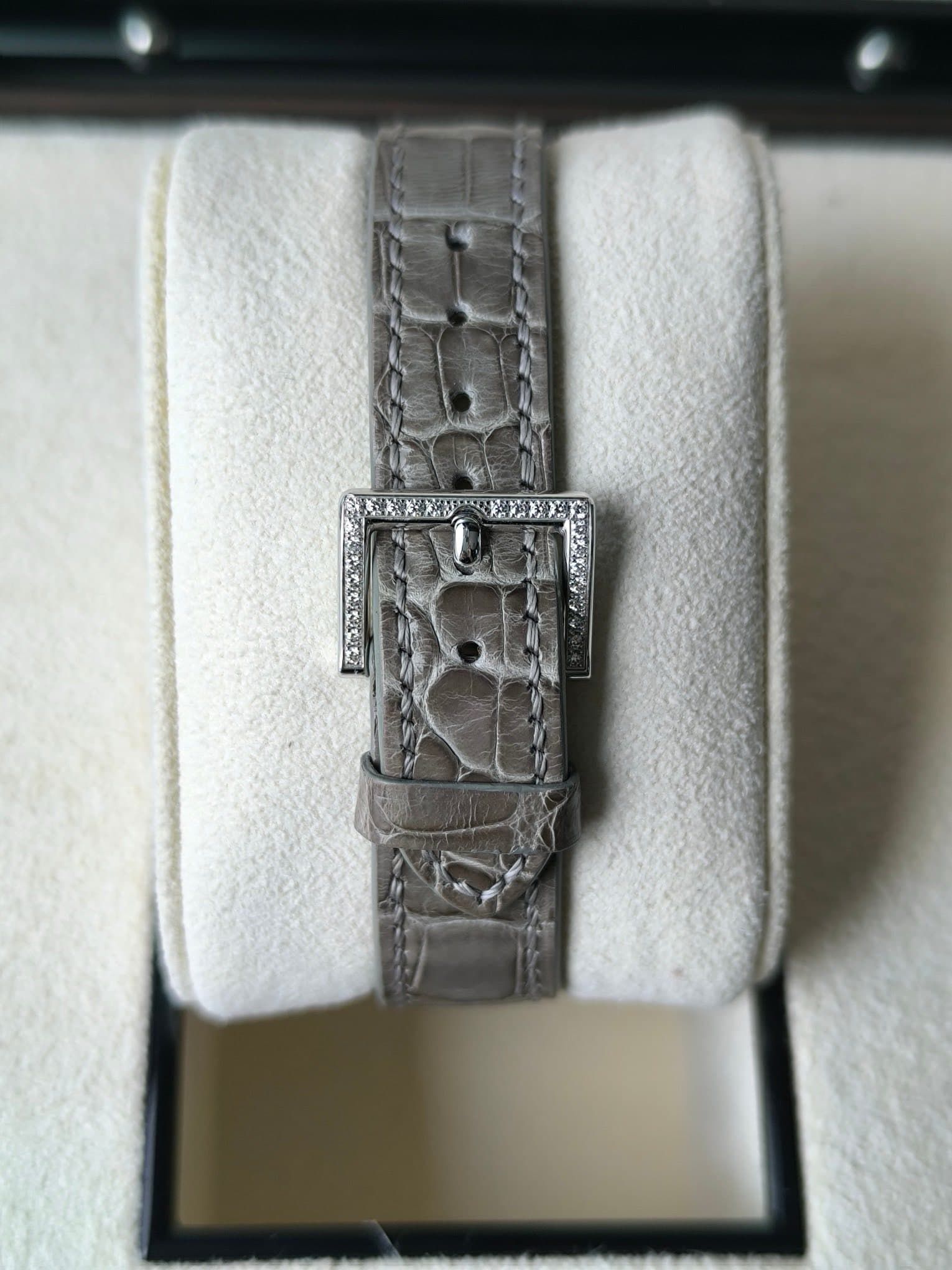 May be an image of wrist watch and jewelry