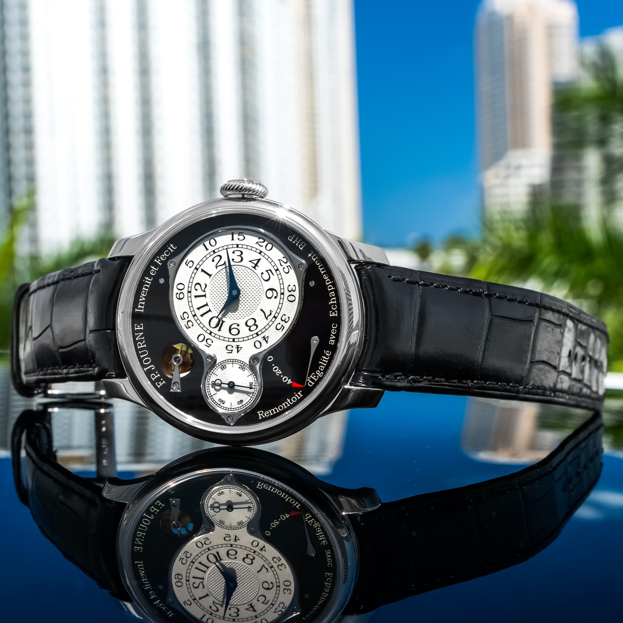 May be an image of wrist watch and text