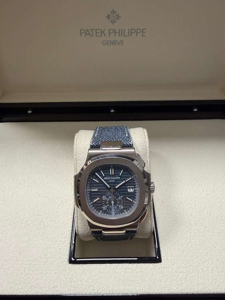 May be an image of wrist watch and text that says 'PATEKPHILIPPE PATEKP GENEVE A A PATEK ATEKFHLIPI KFH FHL HU IPPE 11 မ့တြား e'