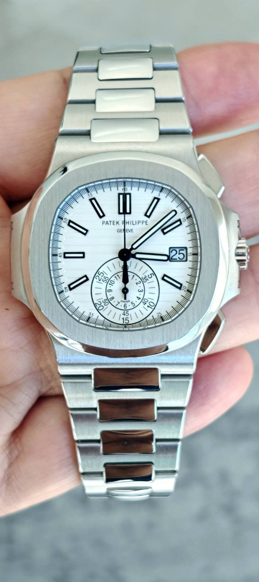 May be an image of wrist watch and text