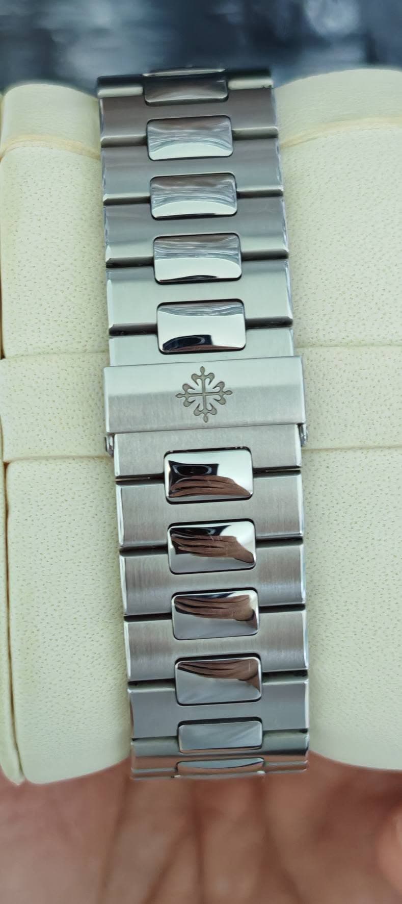 May be an image of wrist watch and text