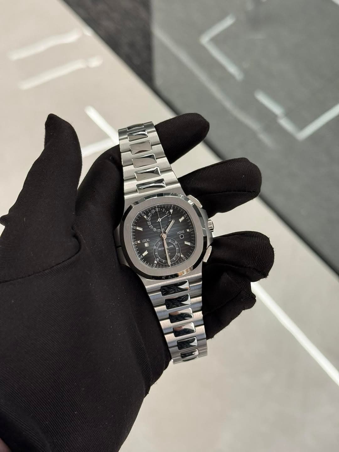 May be an image of wrist watch and text