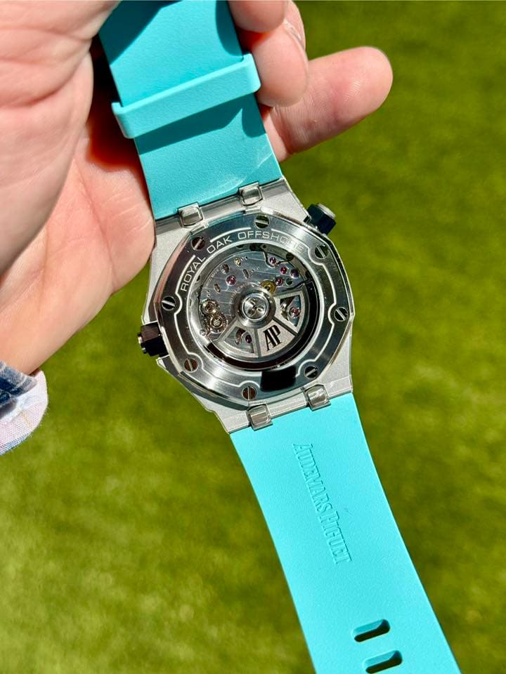 May be an image of wrist watch and text