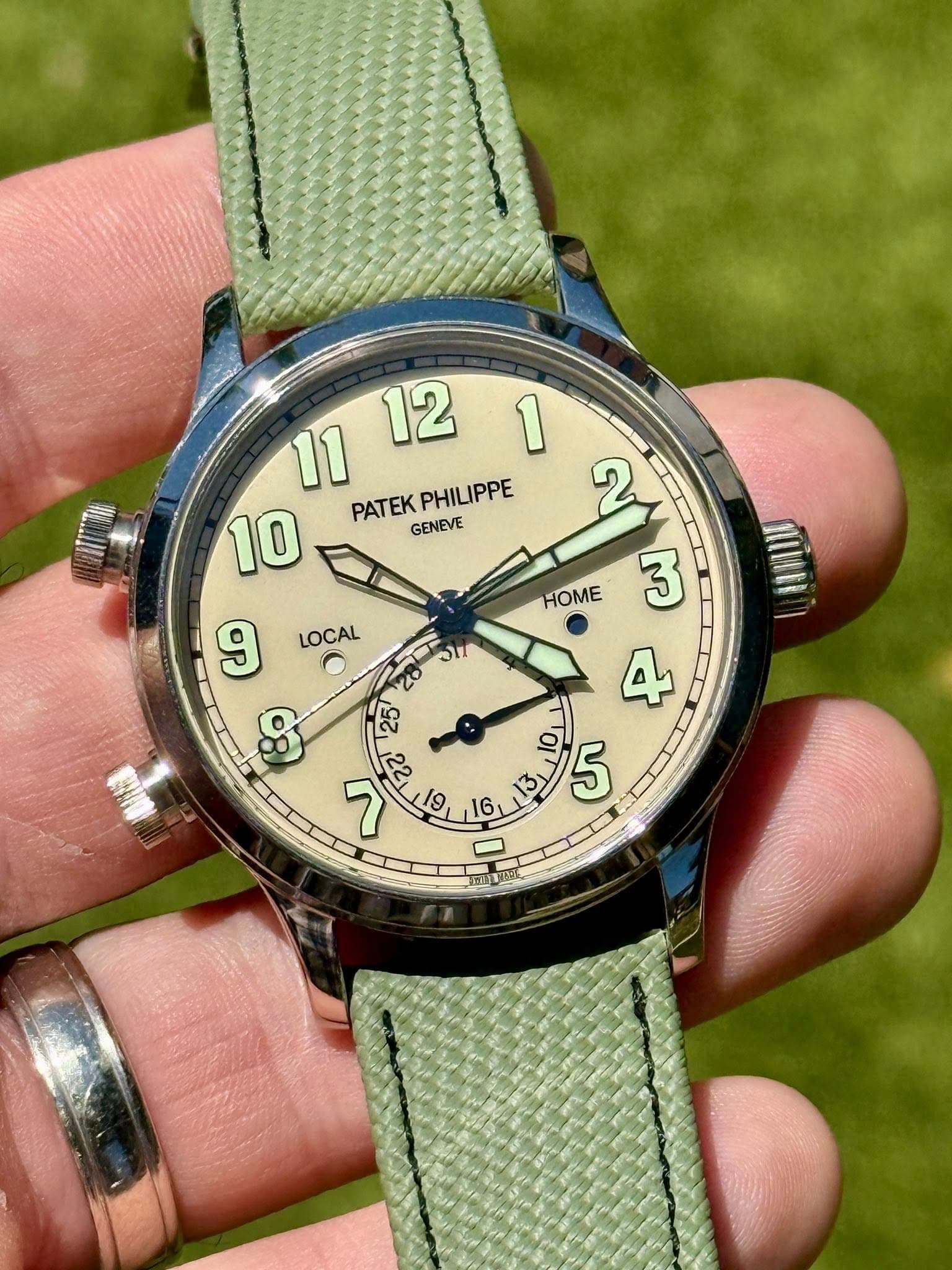 May be an image of wrist watch and text that says ' PATEK PATEKPHILIPPE GENEVE PHILIPPE LOCAL HOME <22 ግ 19 6, '
