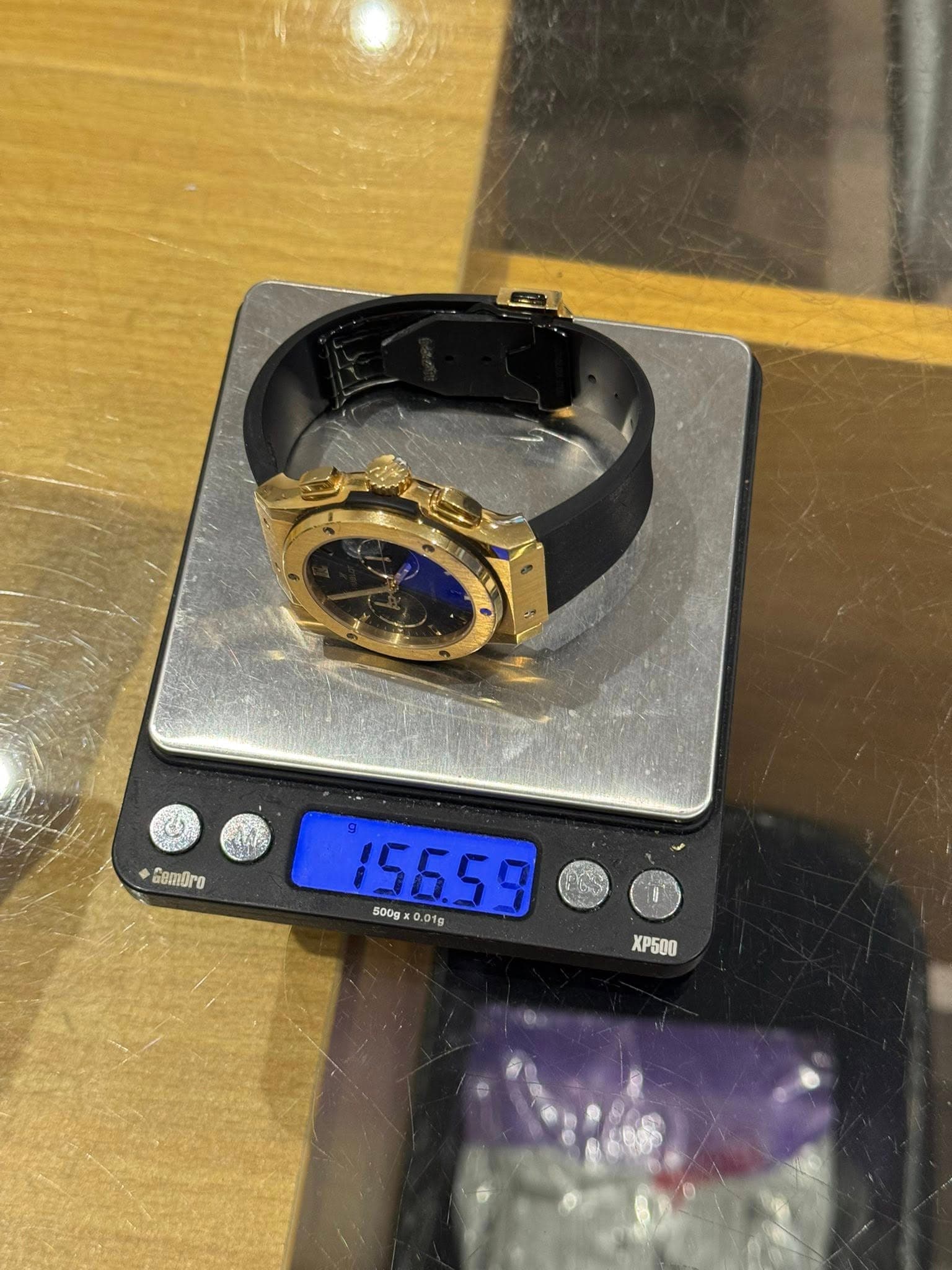 May be an image of digital watch and text that says 'Cam眉re 15659 500g 500gx0.01g x .01g 01g XP6OO'
