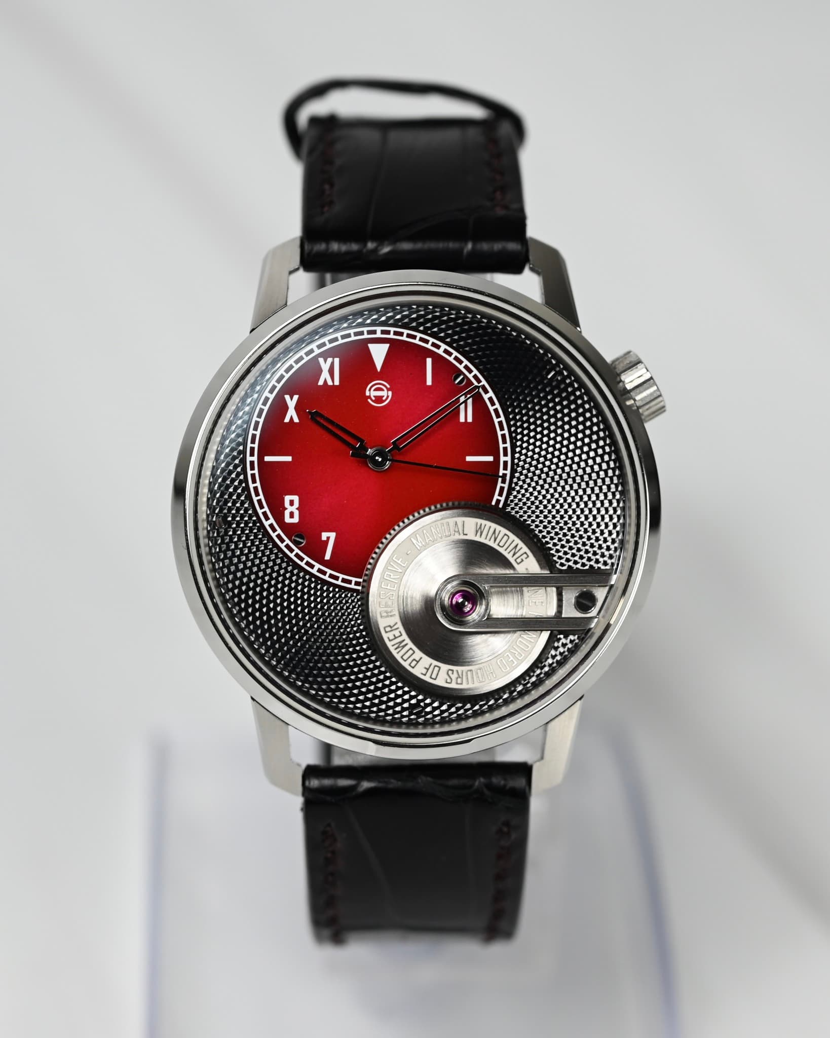 May be an image of wrist watch and text