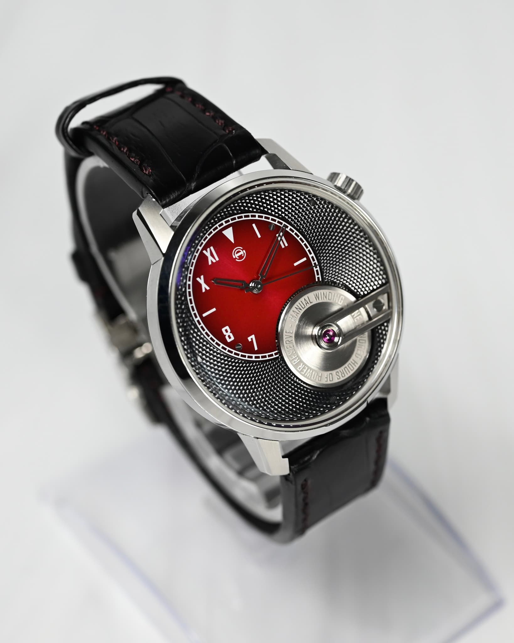 May be an image of wrist watch and text