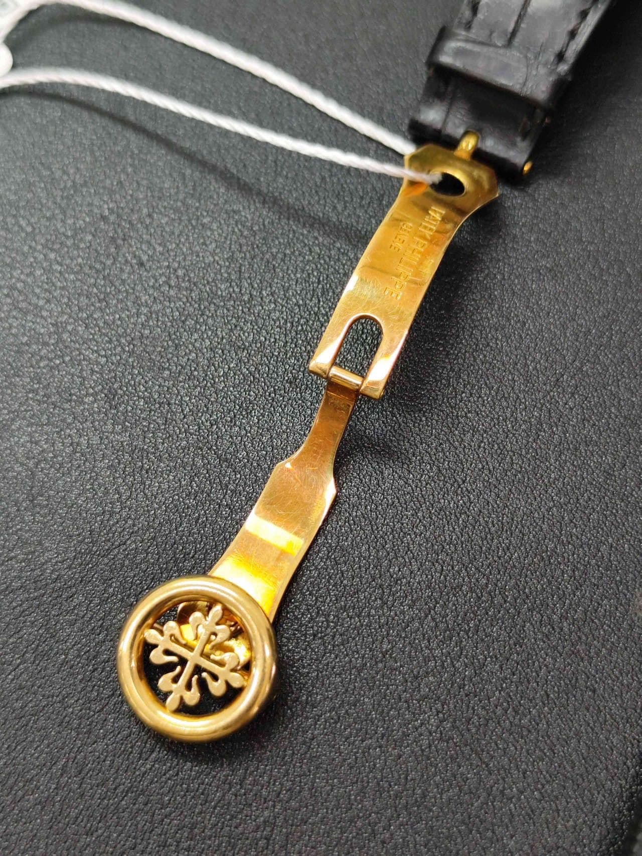 May be an image of leather and wrist watch