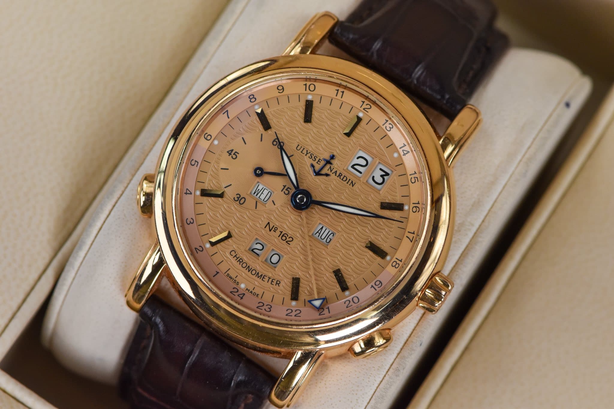 May be an image of wrist watch and text that says ' ULYSSE NARDIN 23 14 16 A 3 15 AUG 30 WED N162 N CHRONOMETER 8L 19 20'
