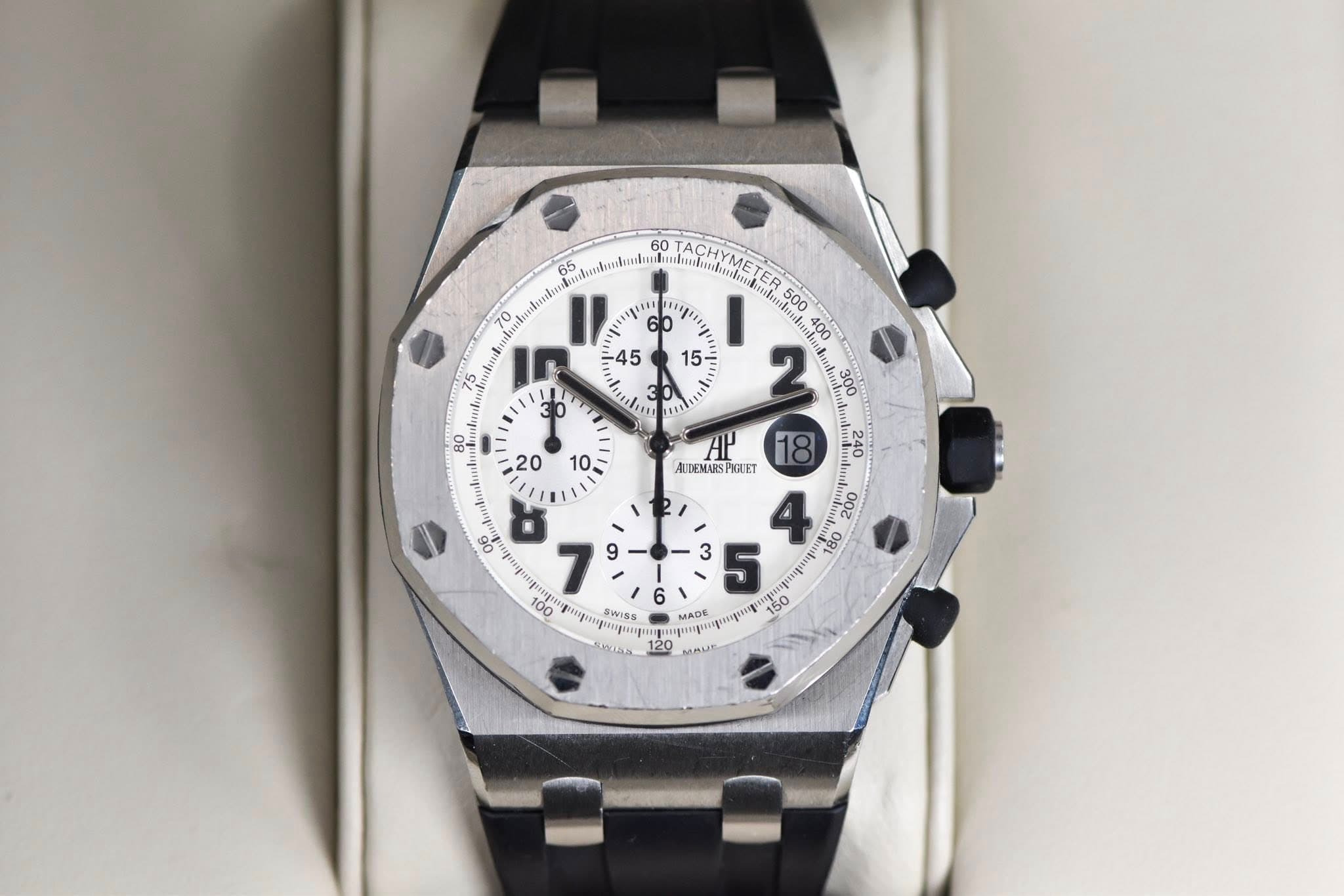 May be an image of wrist watch and text