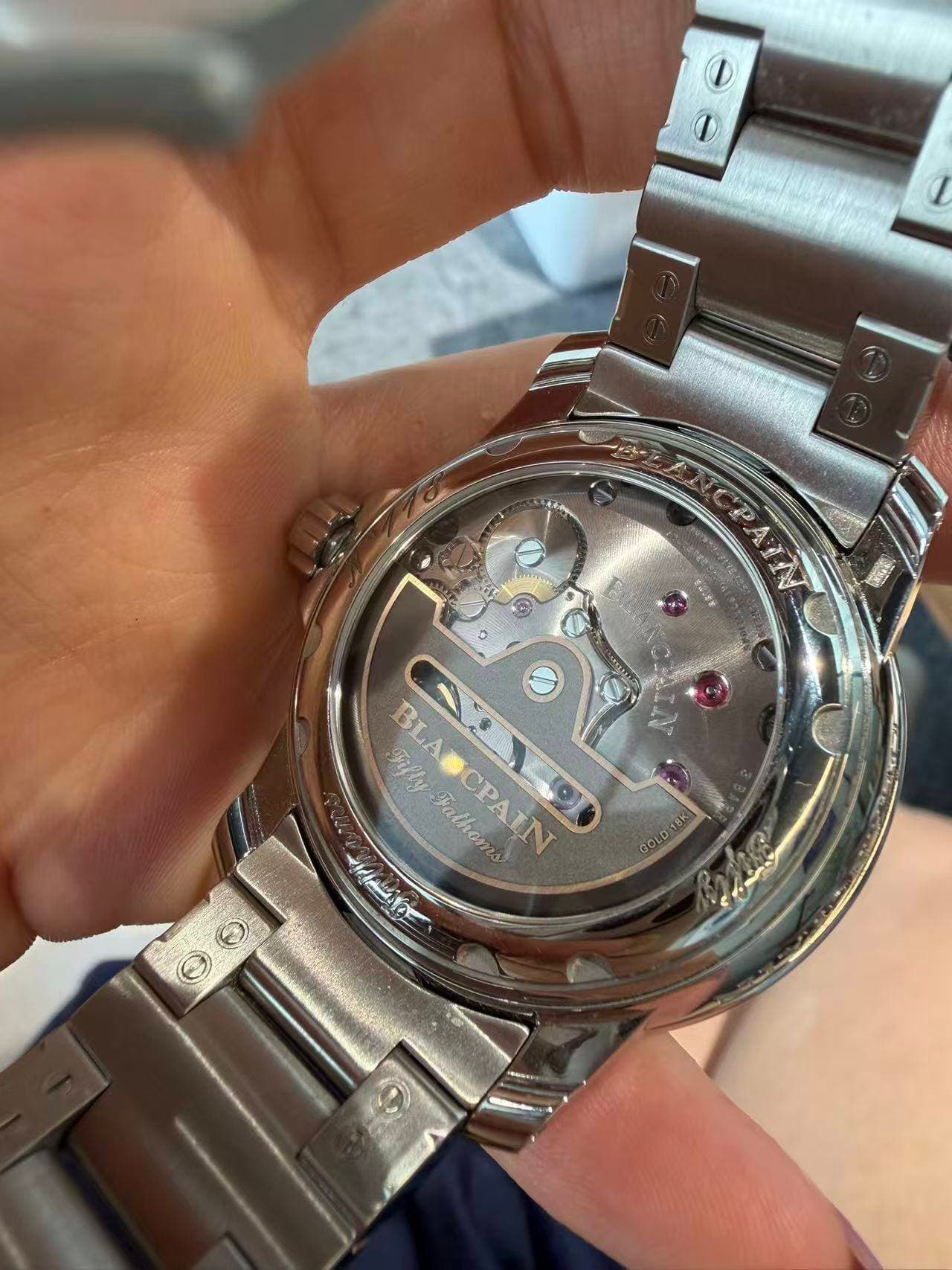 May be an image of wrist watch and text