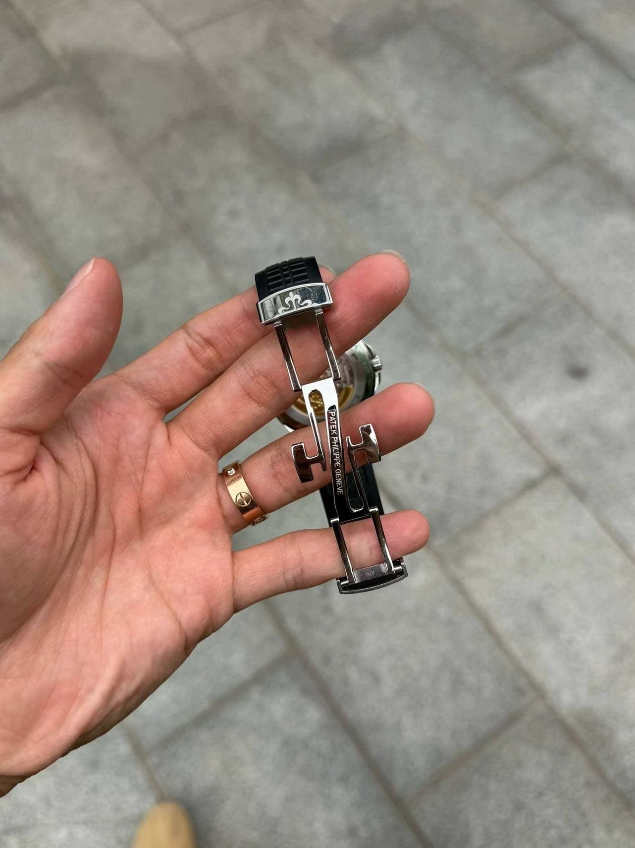 May be an image of jewelry, digital watch and text