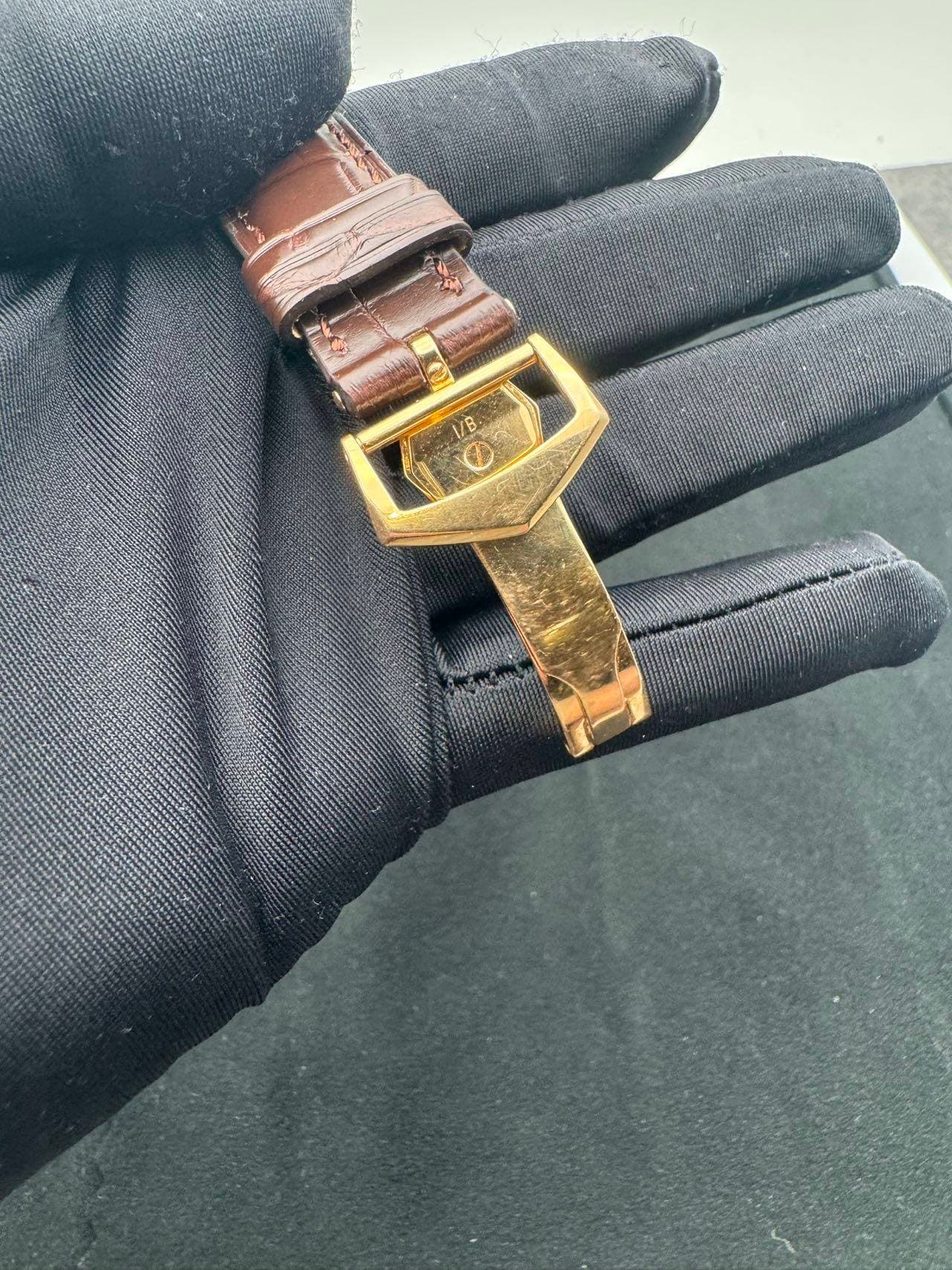 May be an image of wrist watch, saddle-stitched leather and leather