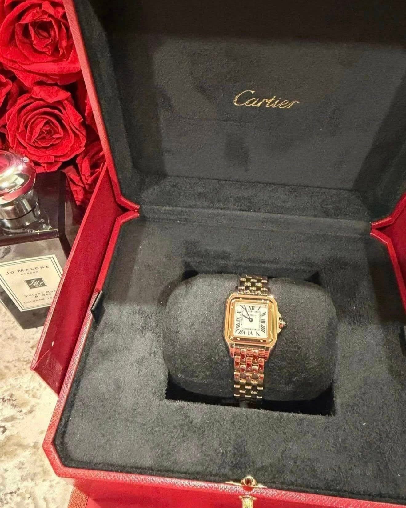 May be an image of wrist watch and text