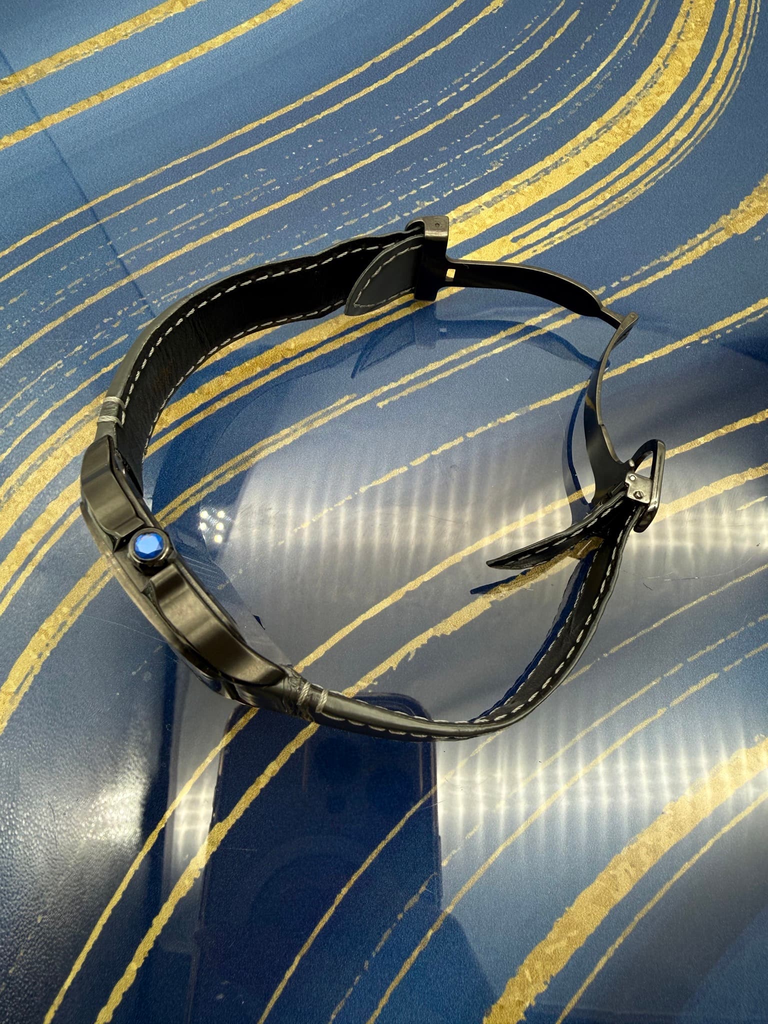 May be an image of leather and wrist watch