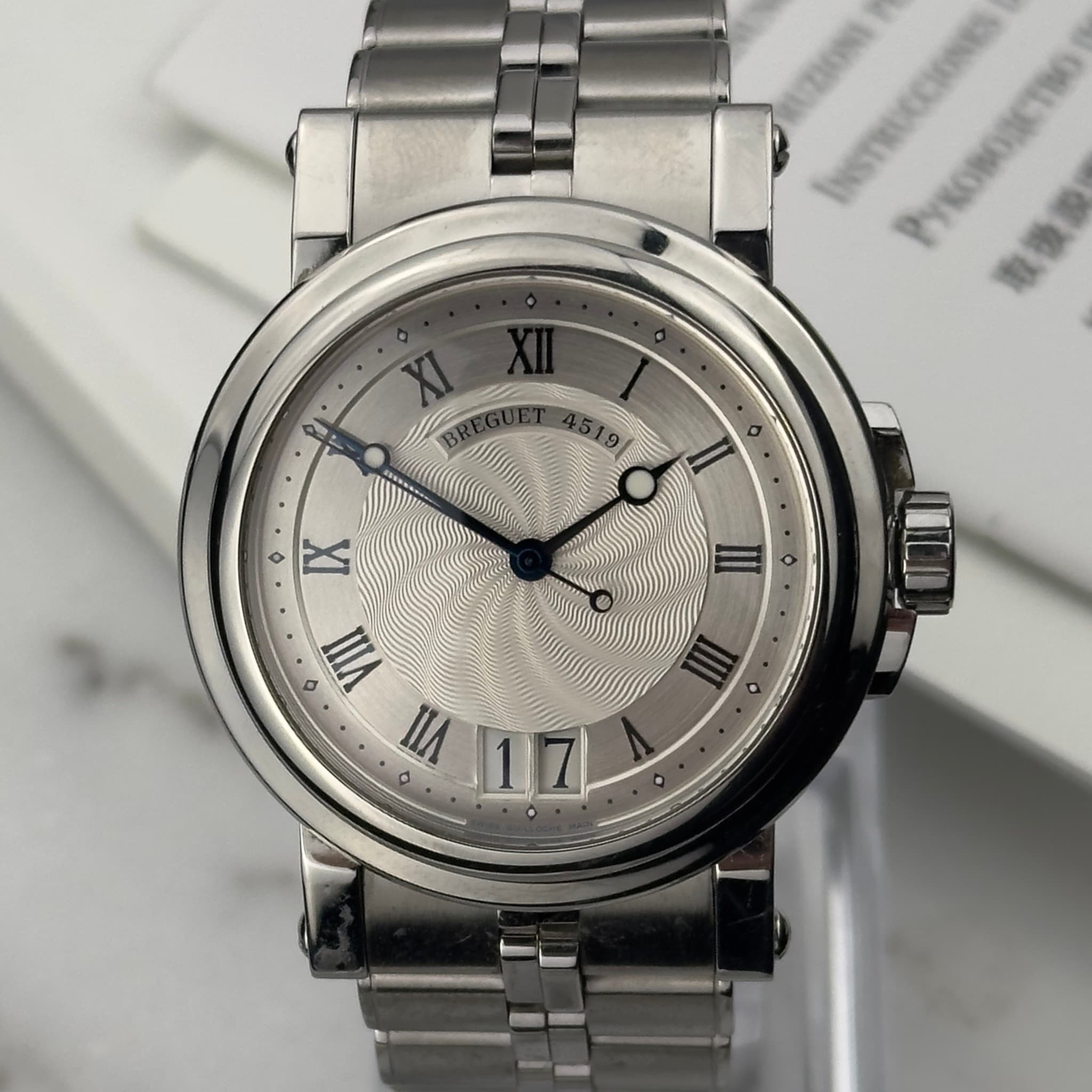 May be an image of wrist watch and text